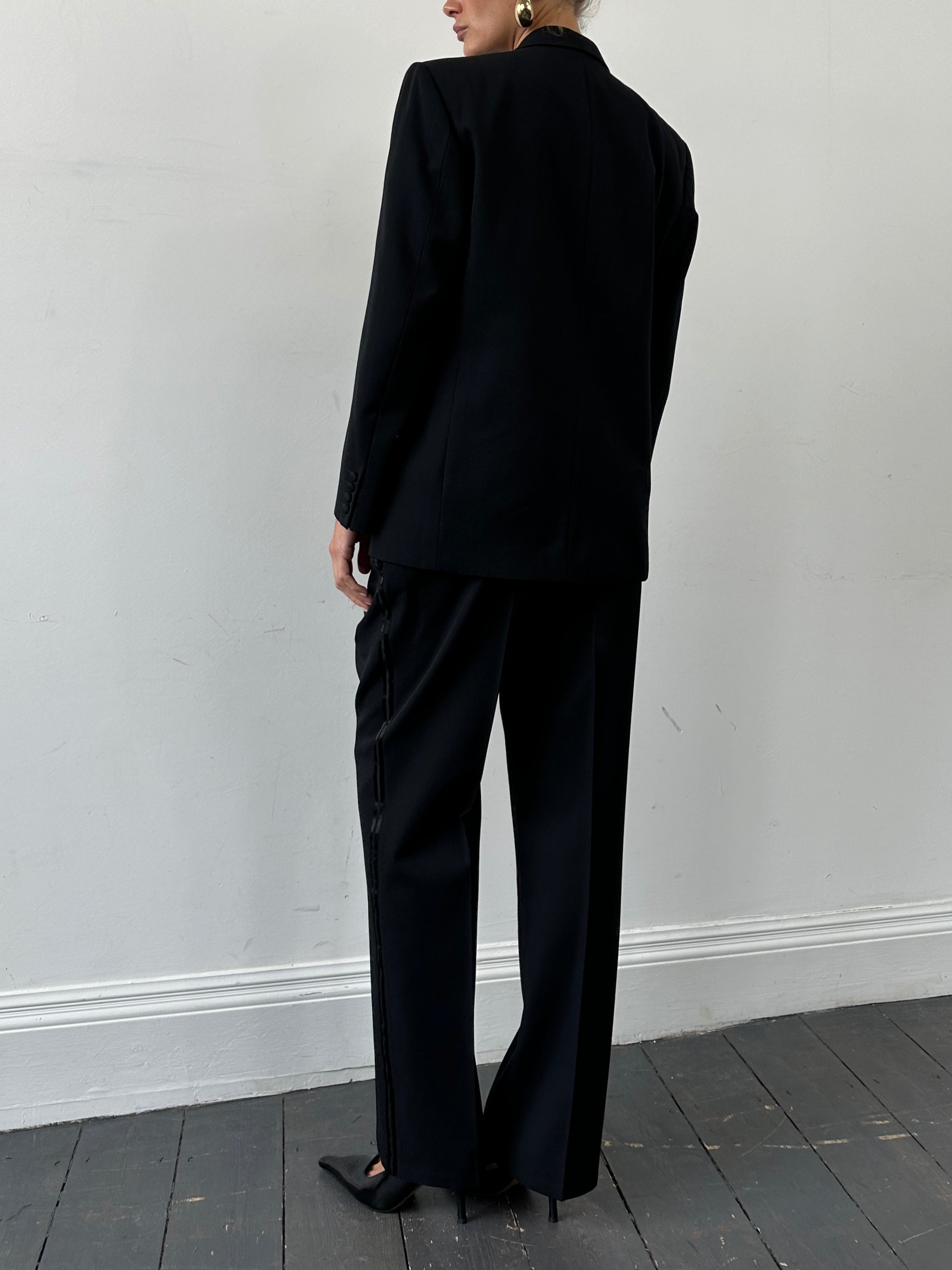 Christian Dior Monsieur tuxedo jumpsuit, double-breasted design, size 42S/W34, tailored fit with classic lapels and sleek fabric.