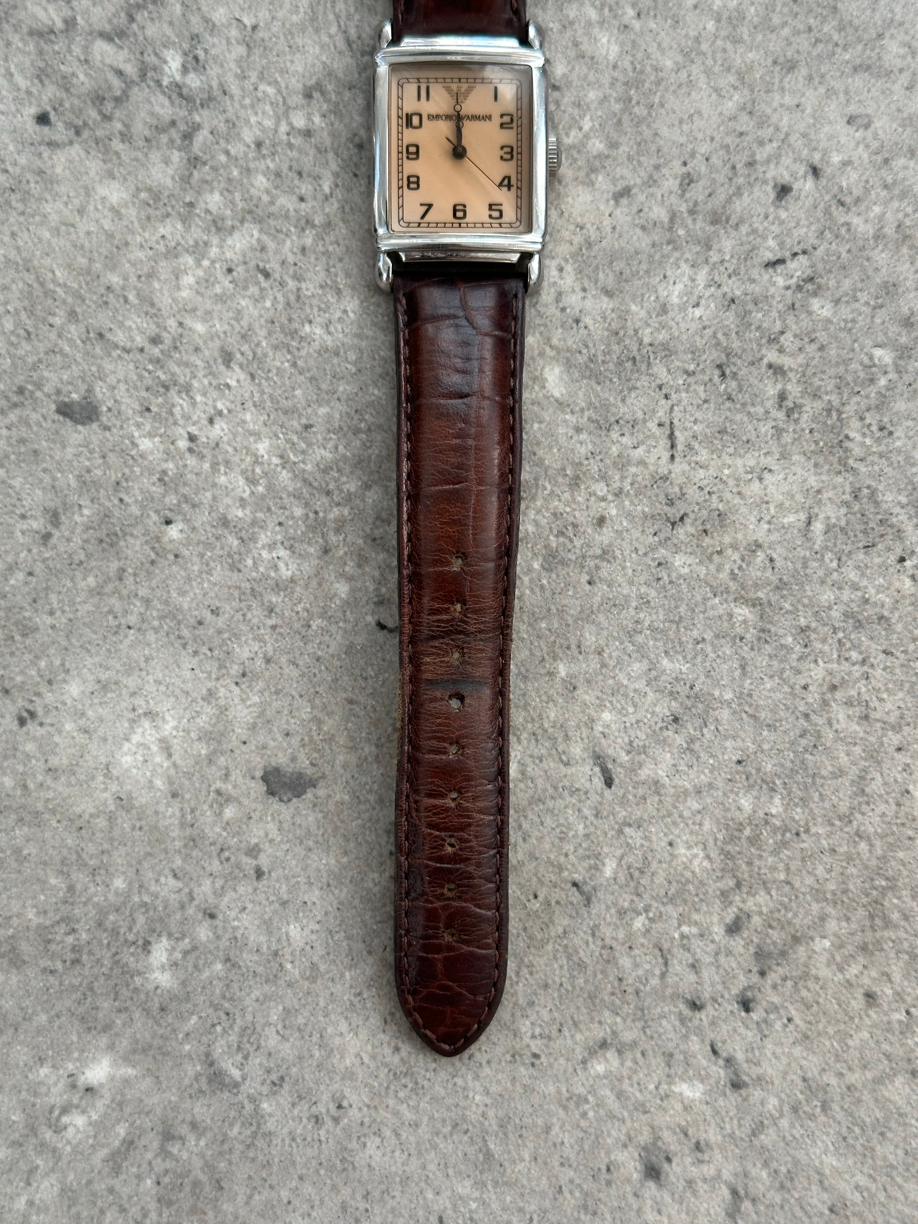 Emporio Armani leather logo watch with round face and sleek design, showcasing the brand's elegant 2000s style.