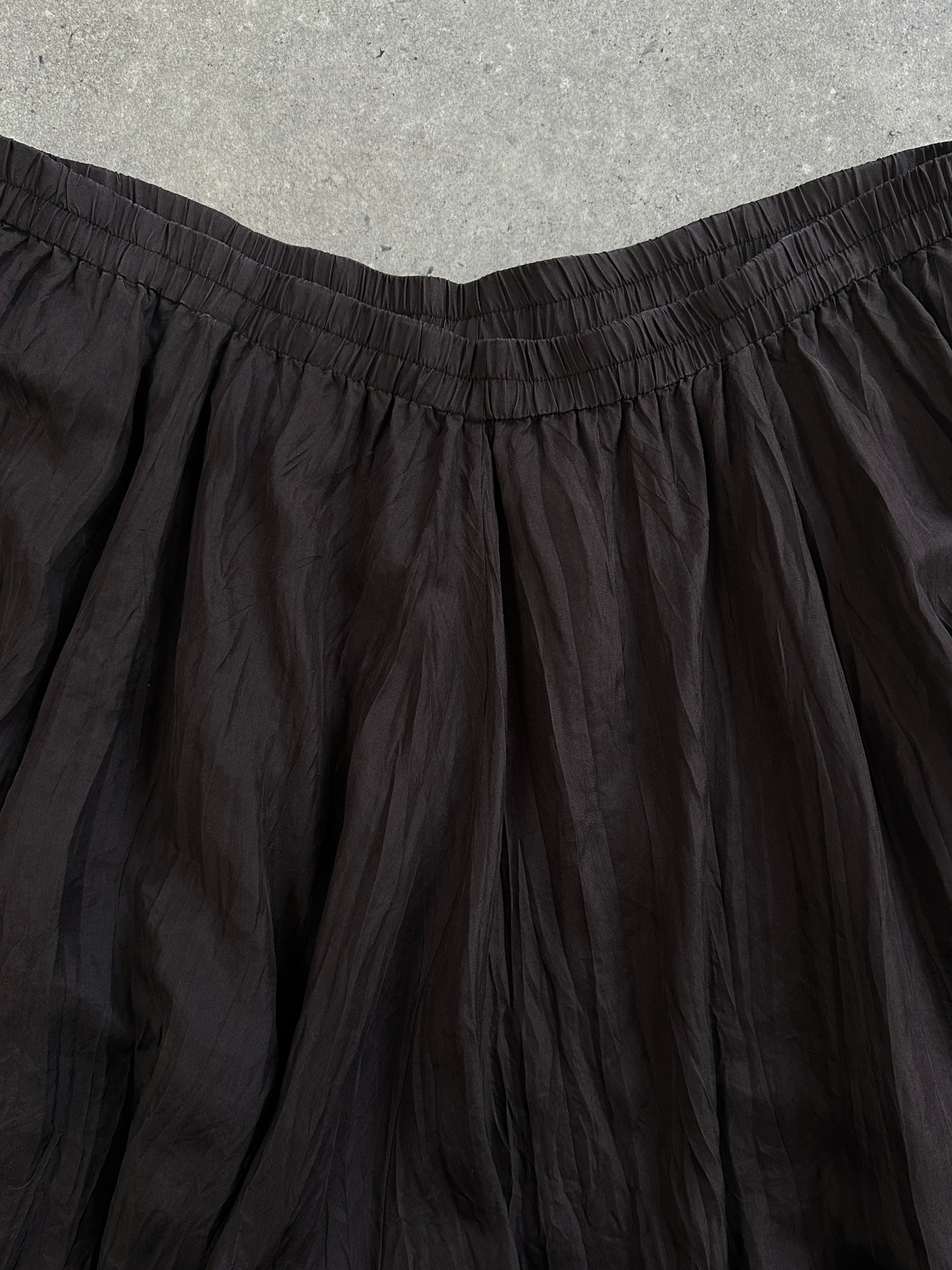 Vintage 1990s pure silk crinkle midi skirt in soft pastel with a flowy, textured design and elastic waistband for a comfortable fit.