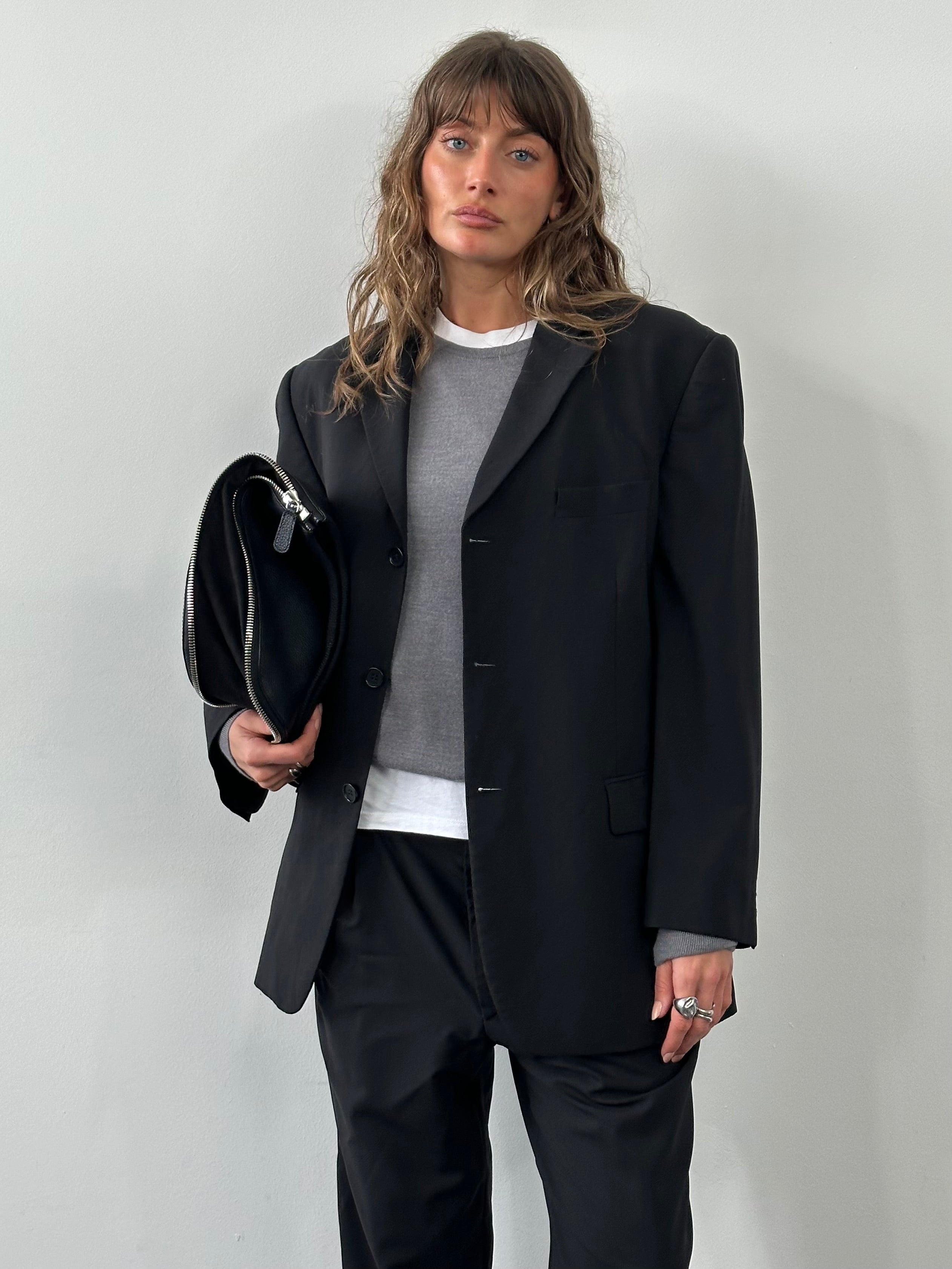 Balmain 1990s pure wool single-breasted suit in size 42S/W34, displayed on a hanger with a classic tailored fit.