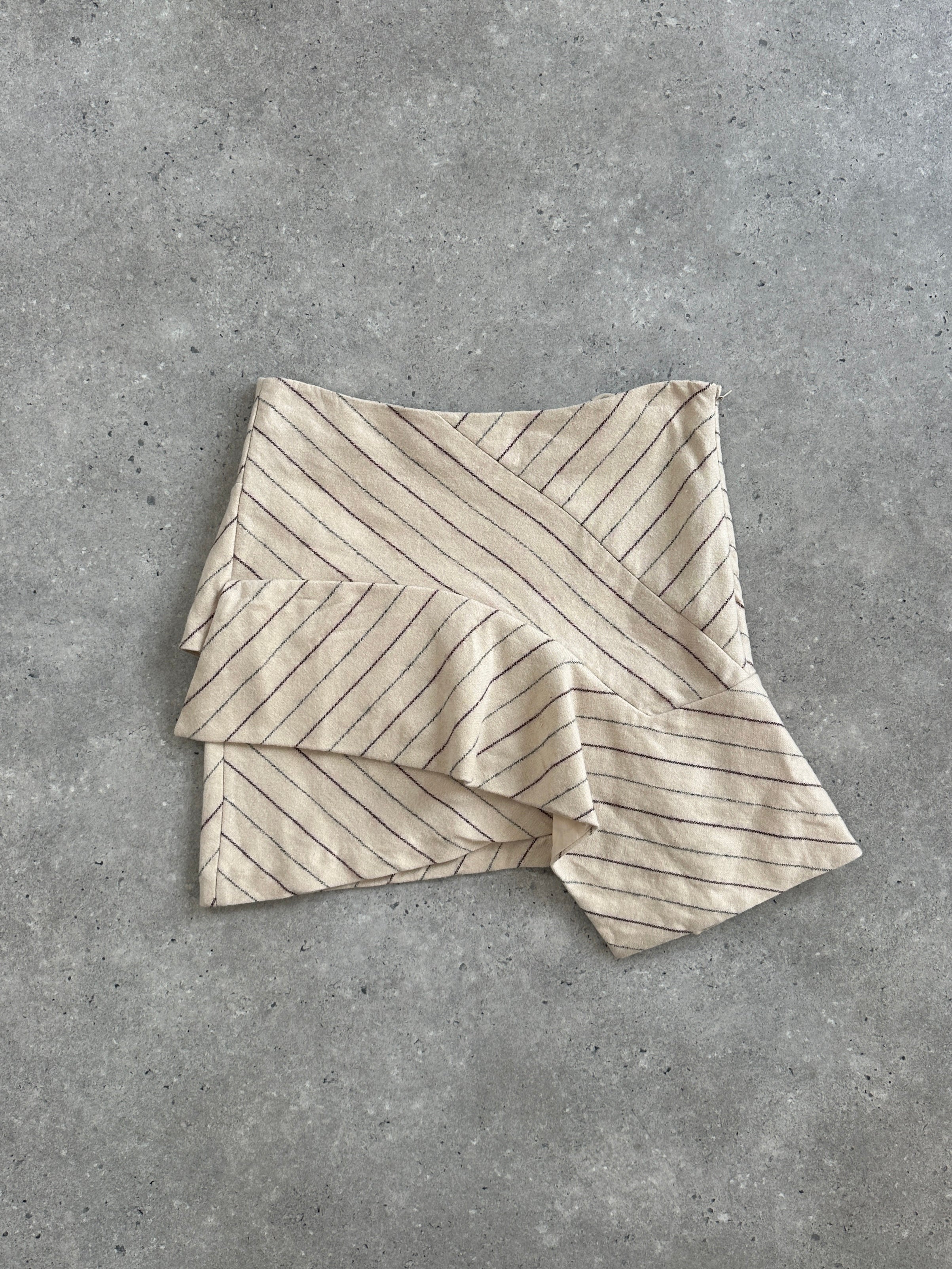 Isabel Marant AW2017 asymmetric layered stripe mini skirt displayed on a hanger, showcasing bold pattern and modern design.