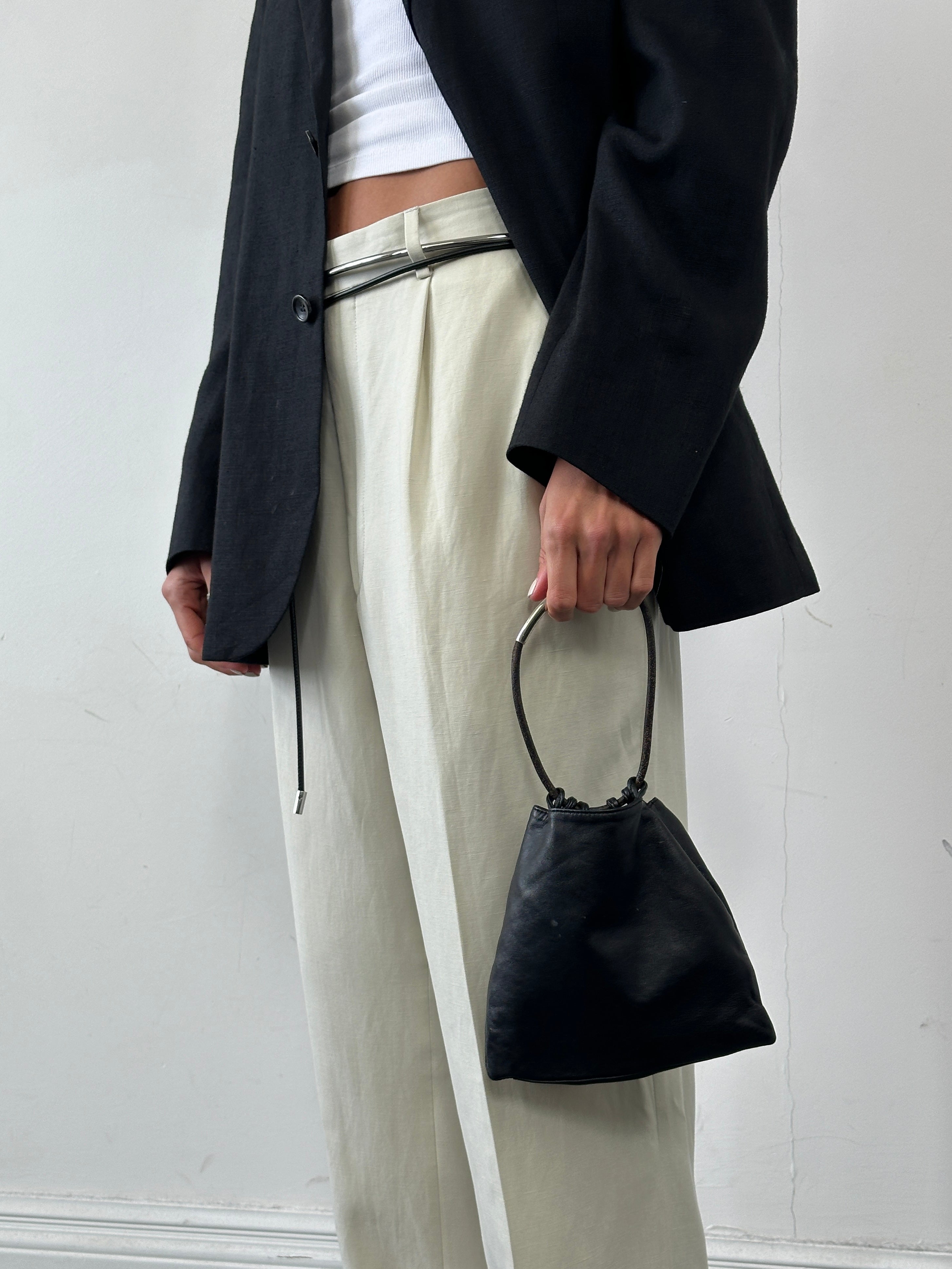 DKNY soft leather clutch bag with sleek design and minimalist style, perfect for evening or casual occasions.