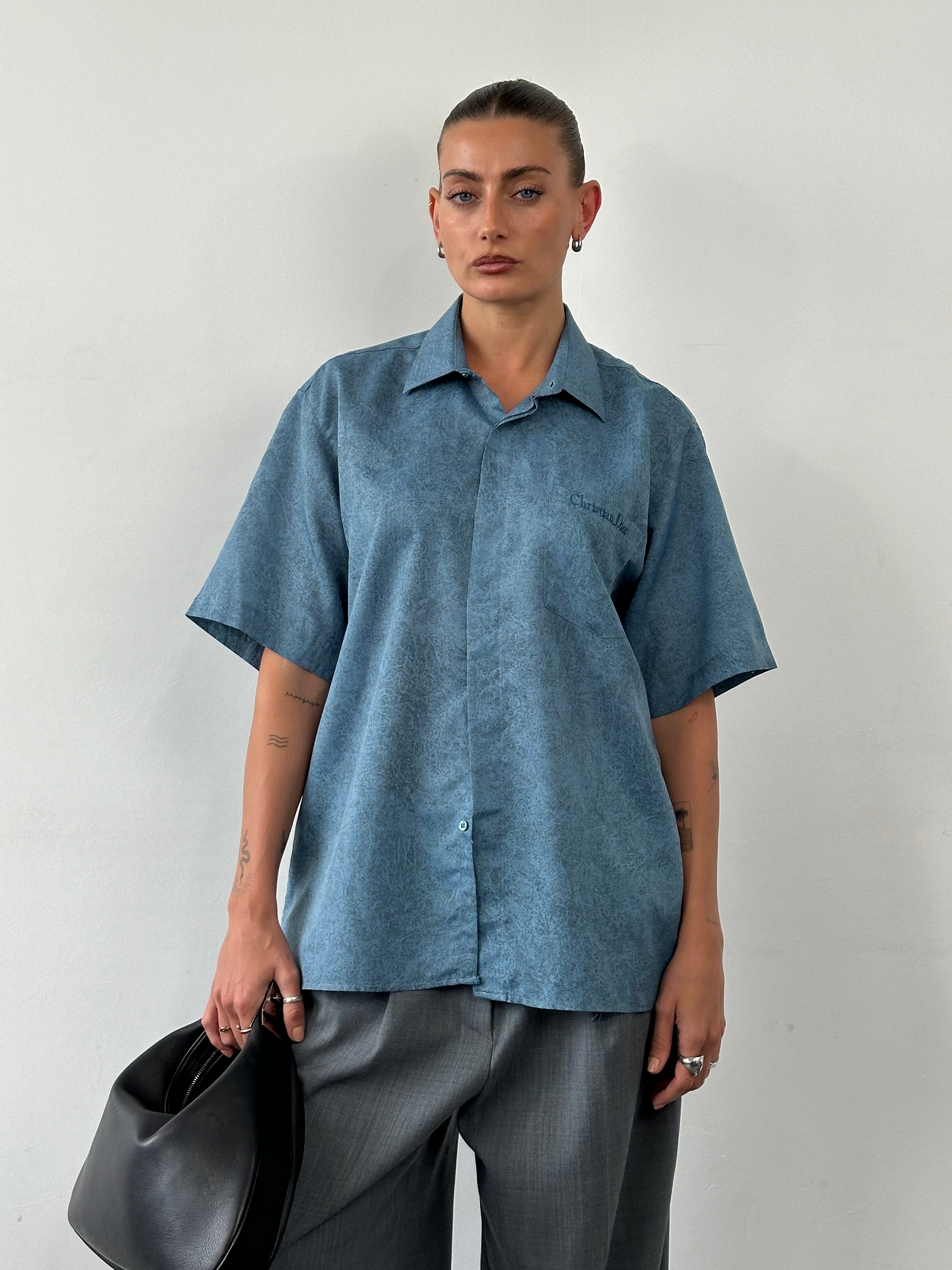 Christian Dior silk print short sleeve logo shirt in size large, featuring vibrant pattern and classic design