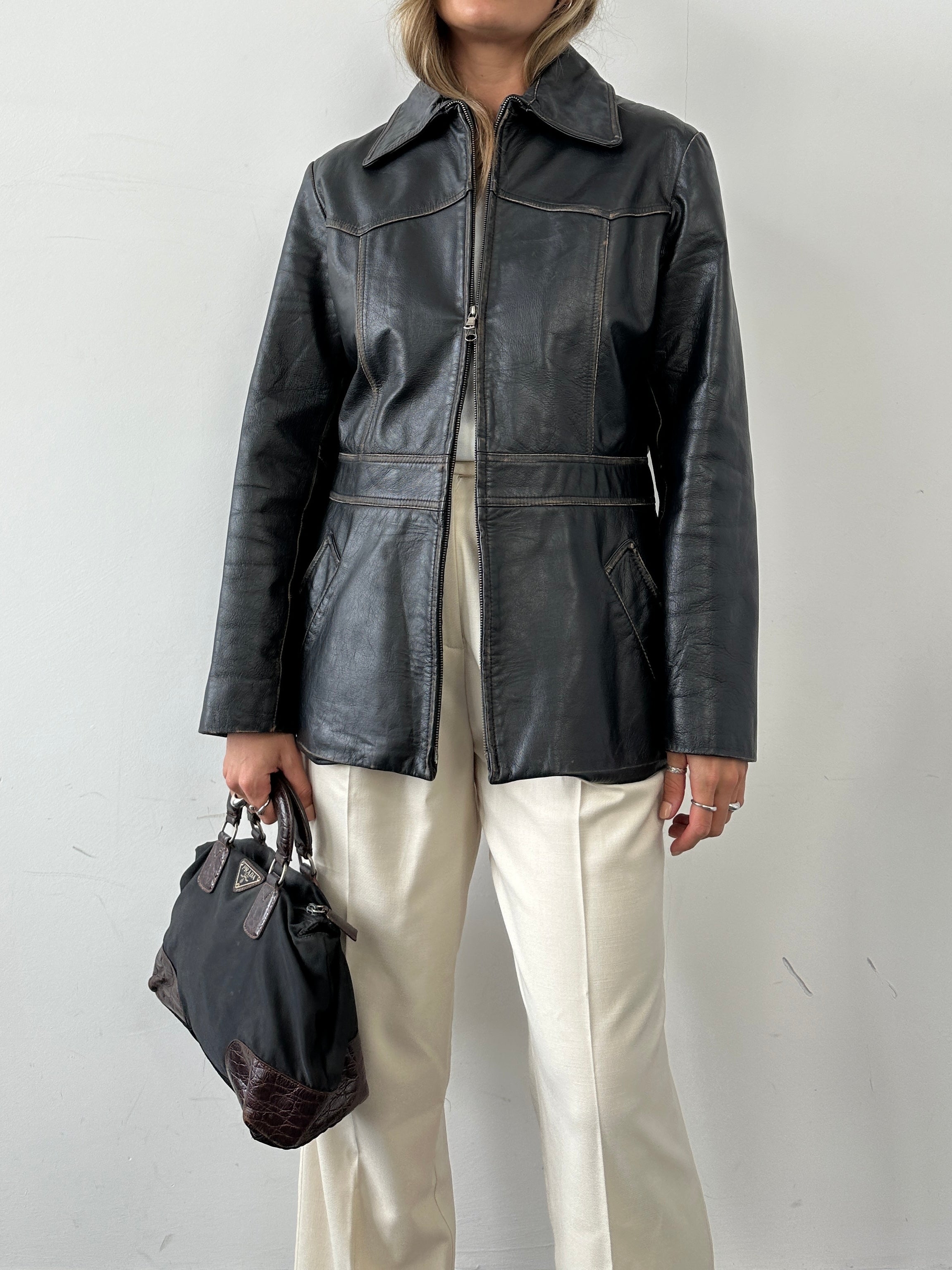 Conbipel double zip waisted leather jacket for women, featuring a sleek design and stylish front zippers.