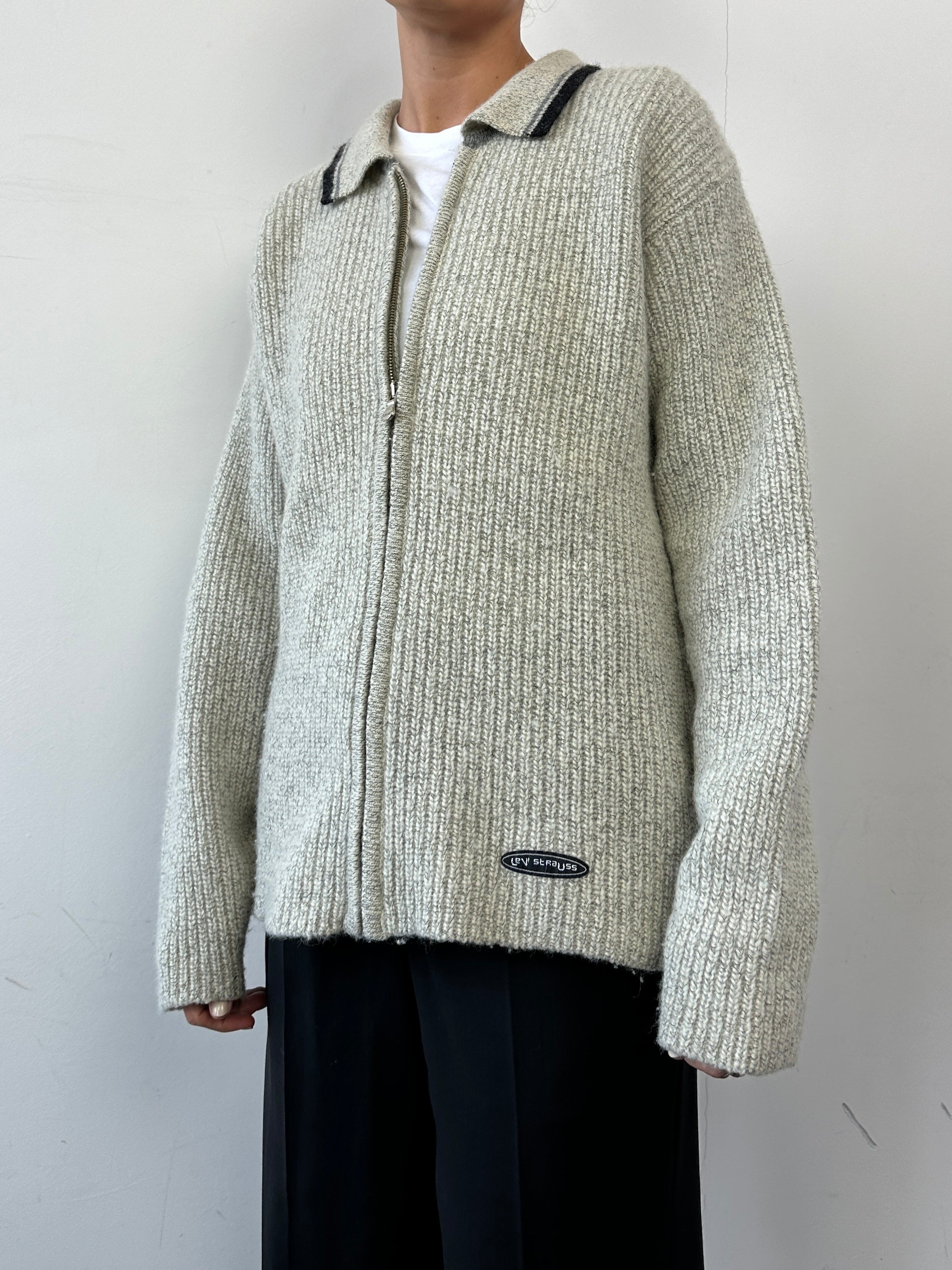 Levi’s wool zip-up knitted cardigan in size L, featuring a cozy design with a front zipper and ribbed cuffs.
