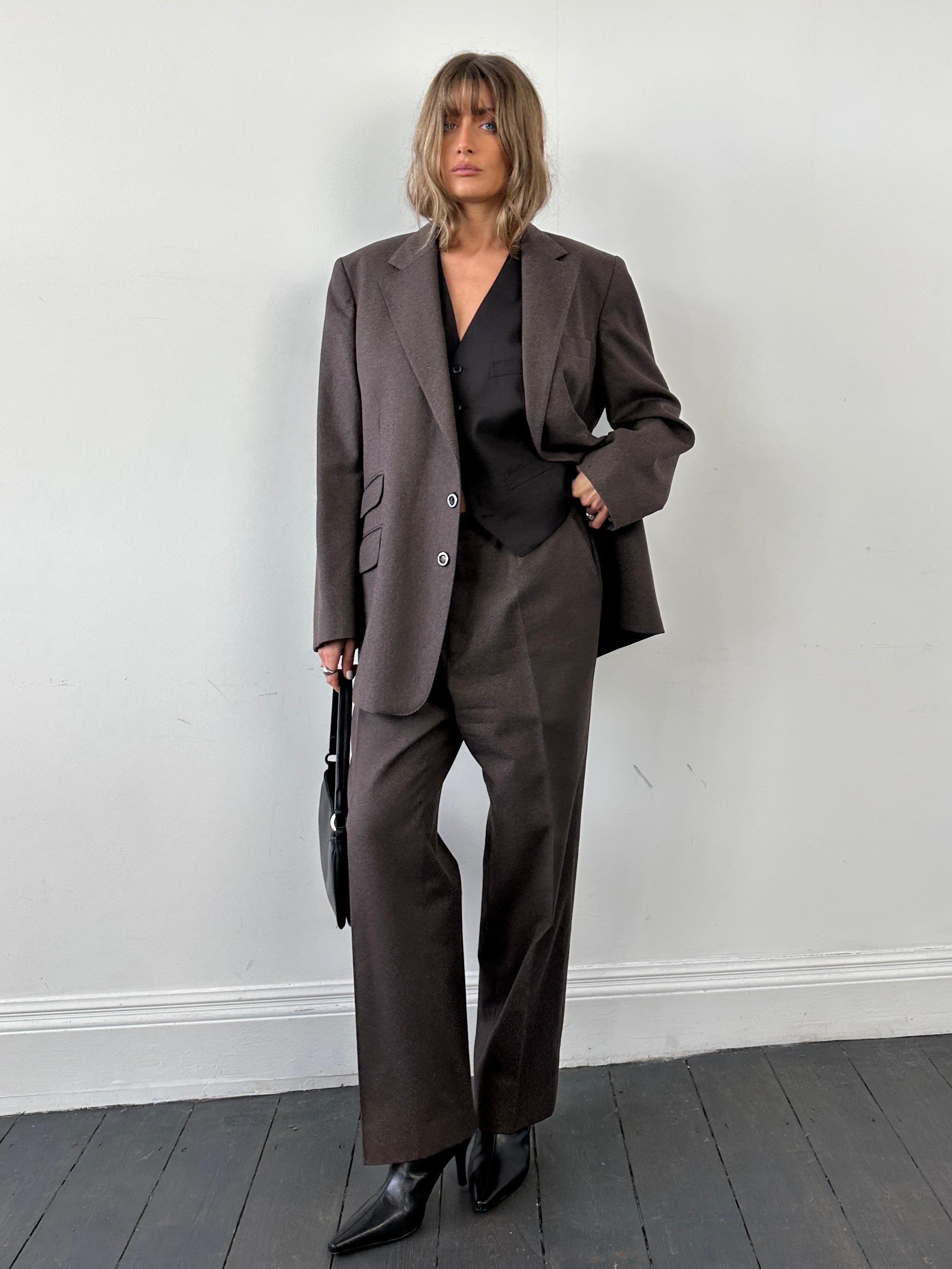 Christian Dior pure wool jumpsuit in size 46R/W34, tailored fit with classic design and elegant craftsmanship.