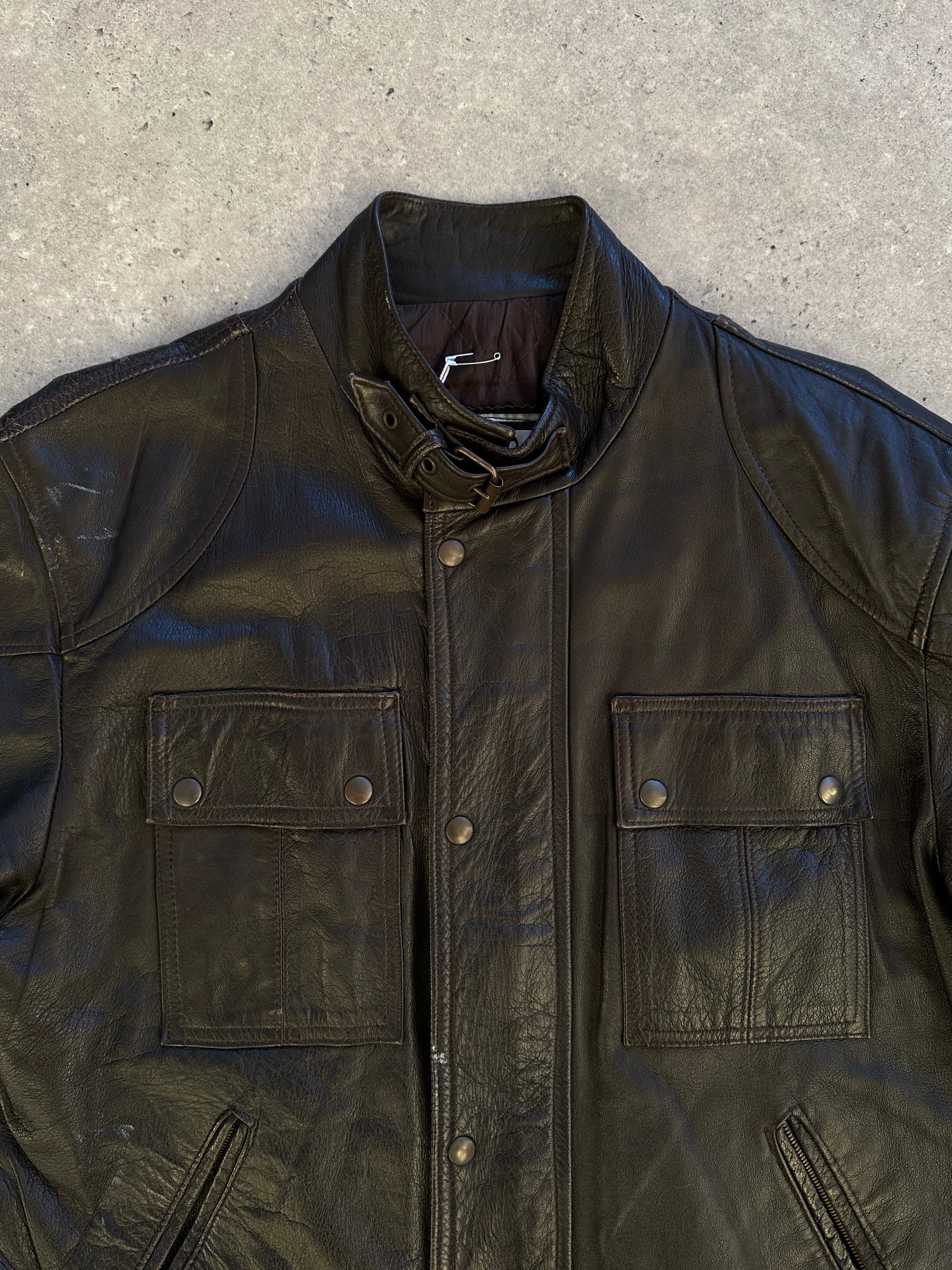 Vintage Italian vintage moto leather jacket in size small, featuring classic design and durable leather construction.