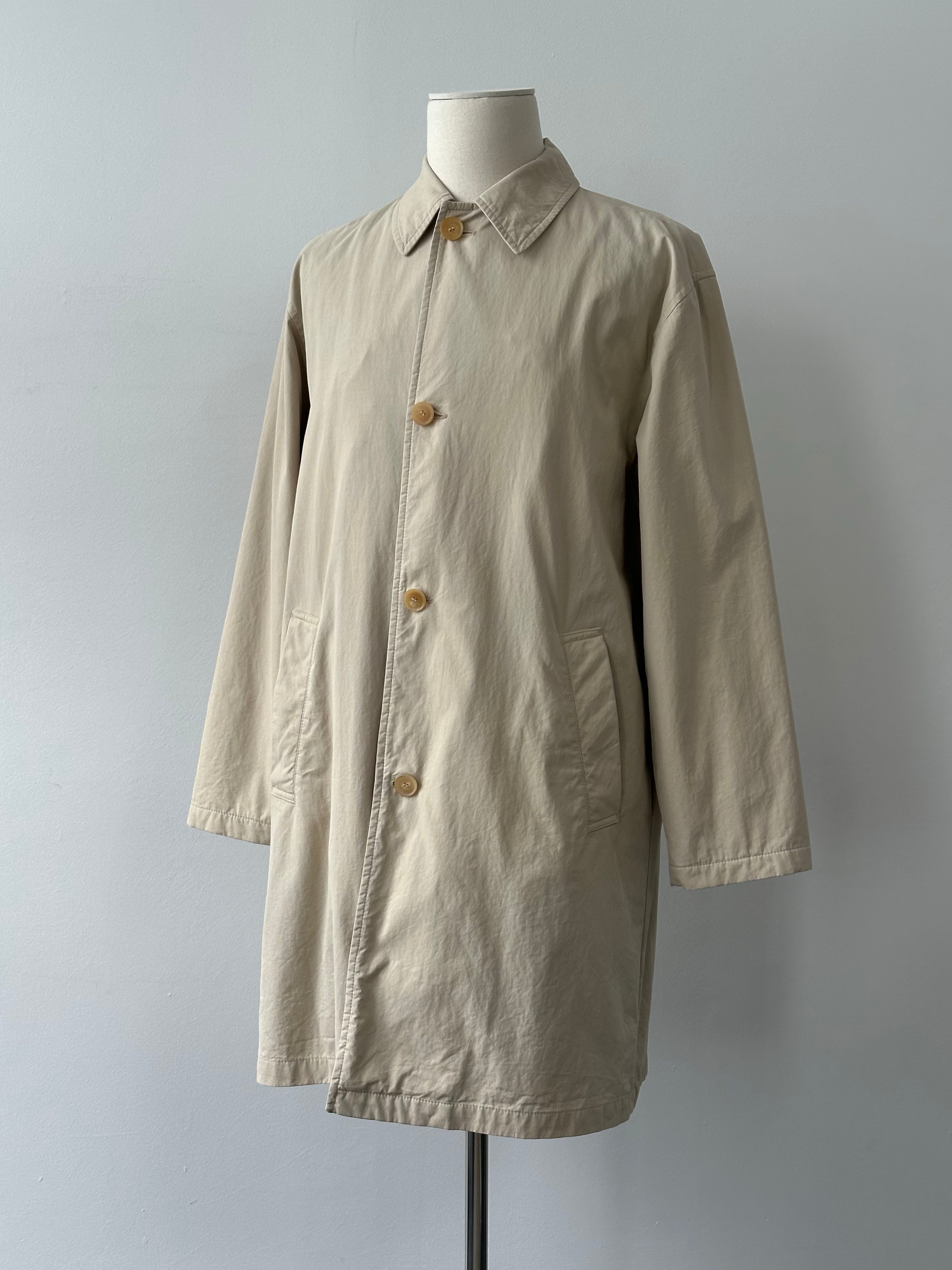 Hugo Boss 2000s cotton trench coat with concealed placket, beige color, long sleeves, and classic collar.