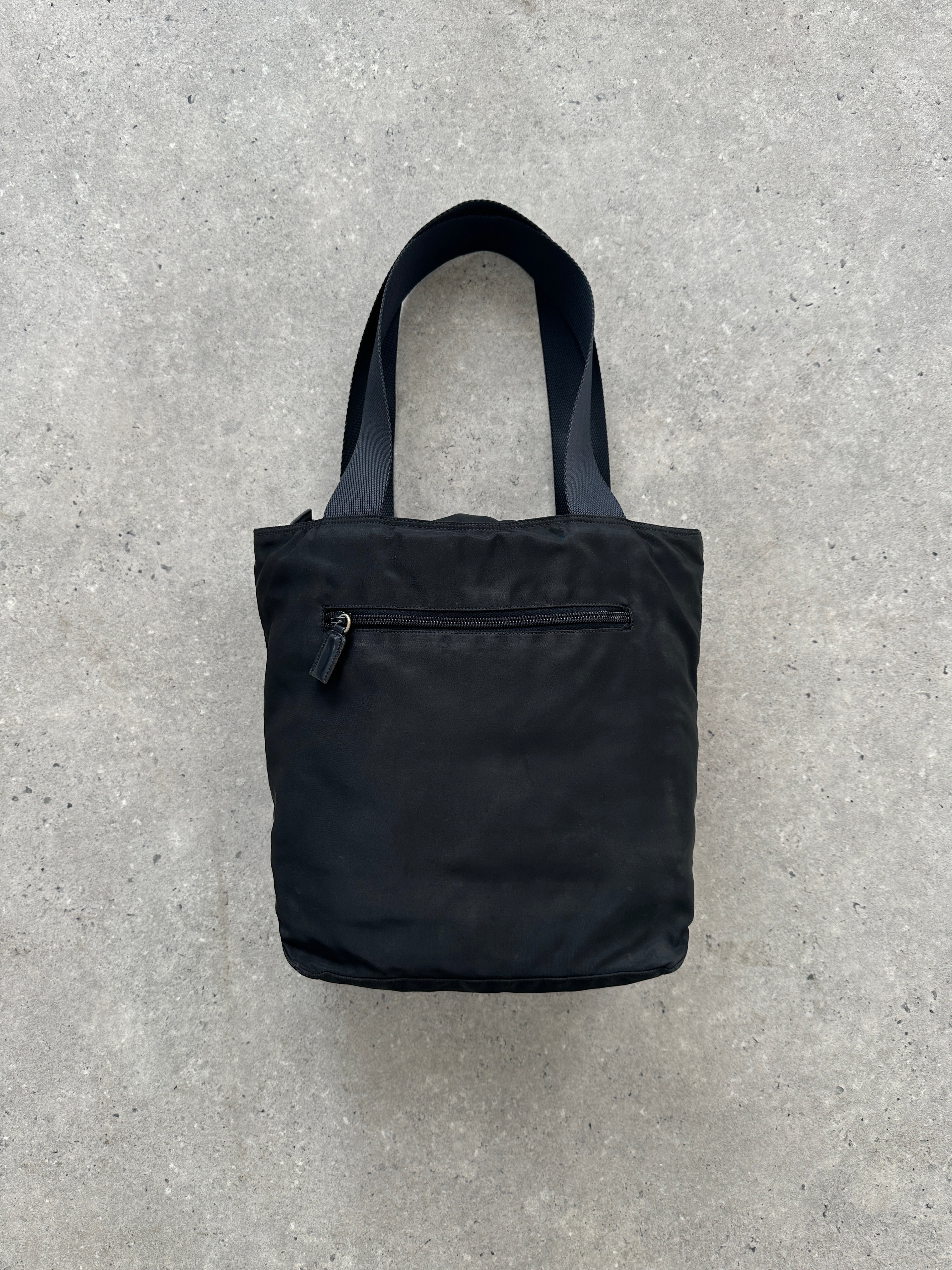 Prada 1997 Nylon Shoulder Bag in black with adjustable strap and Prada logo, stylish and functional accessory.