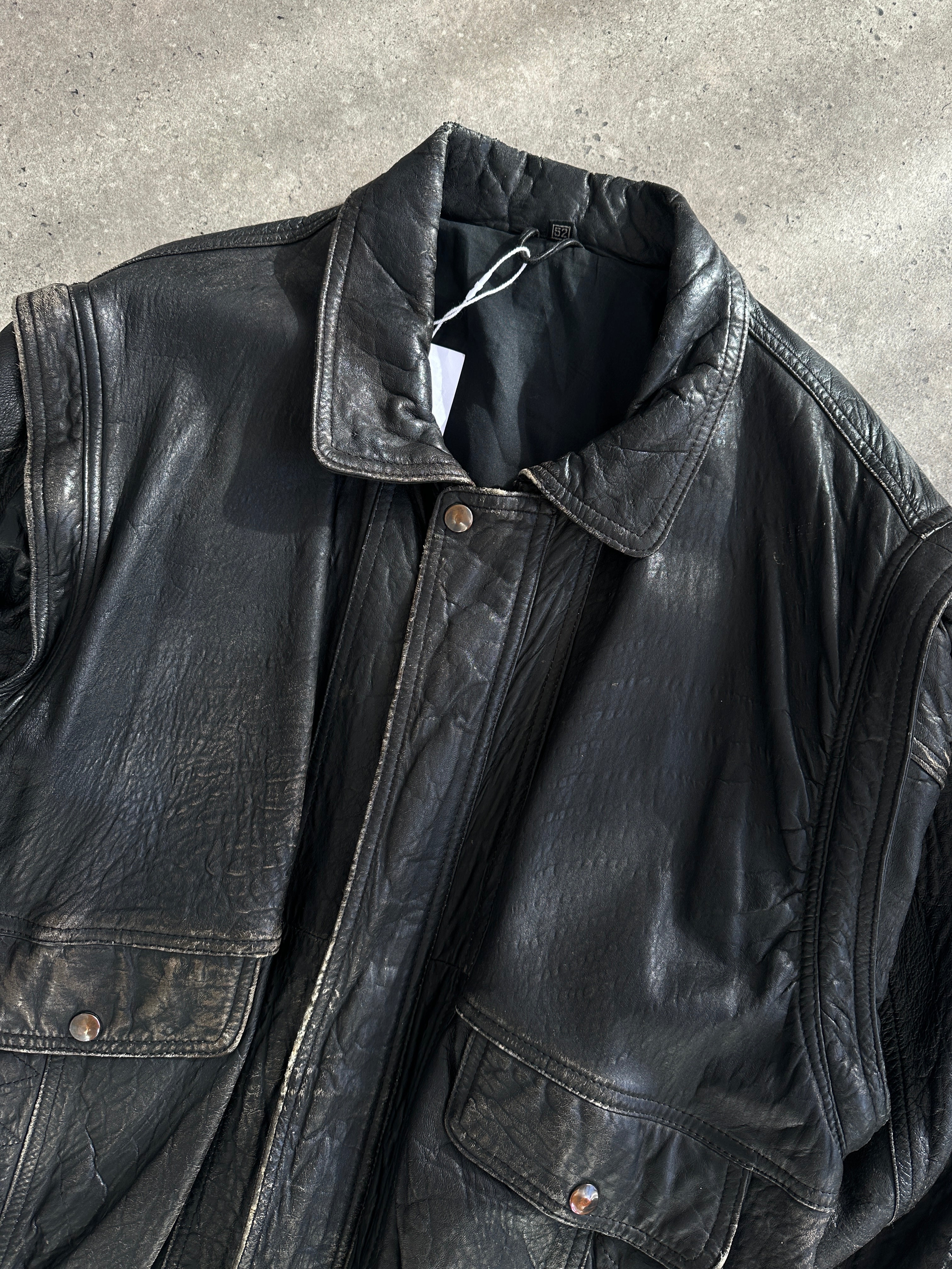Vintage distressed leather bomber gilet jacket in size M/L, featuring rugged design and classic leather texture.