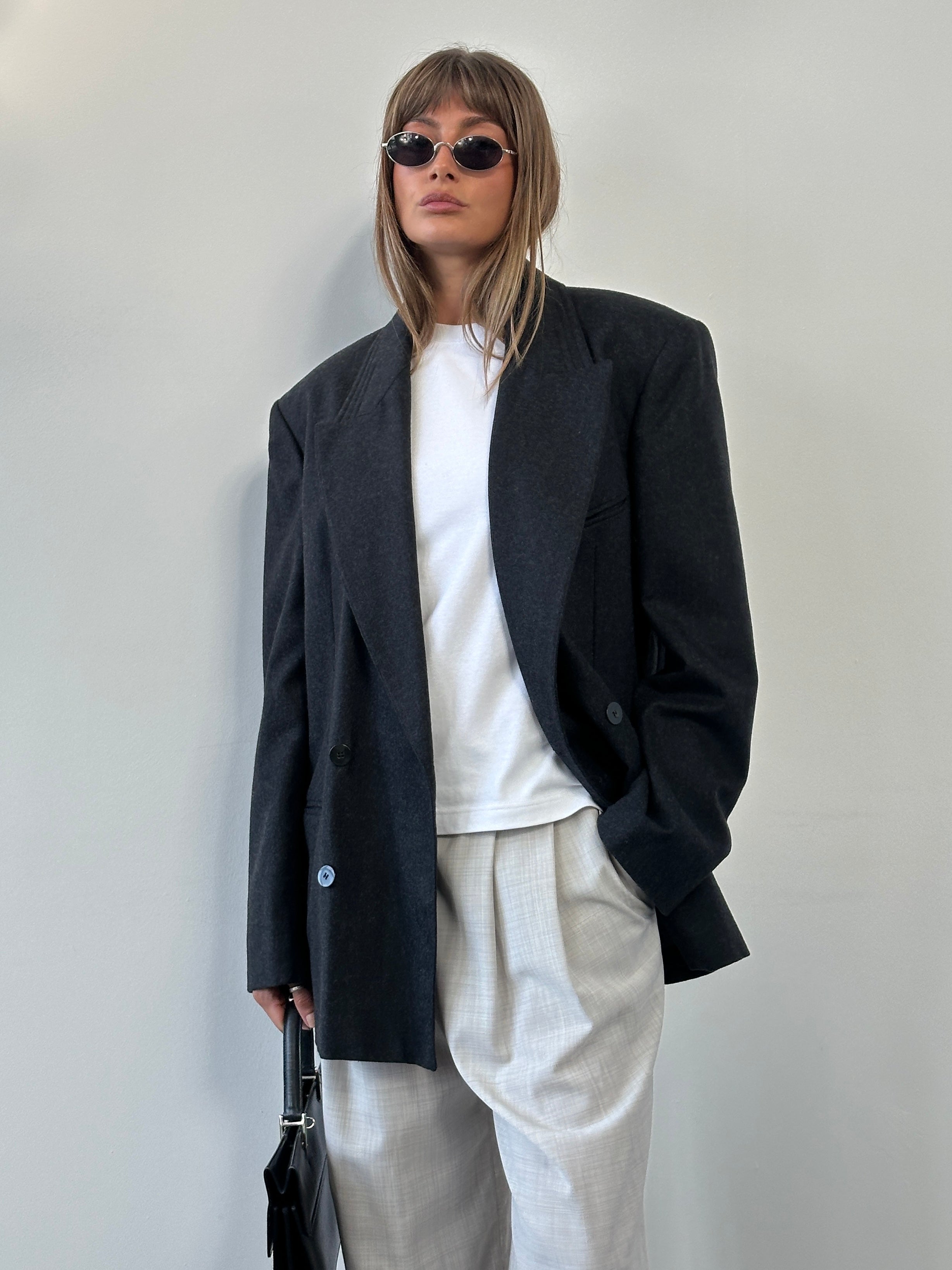 Vintage Italian pure wool double-breasted blazer with peak lapels in size 40R/XL, featuring classic tailoring and textured fabric.