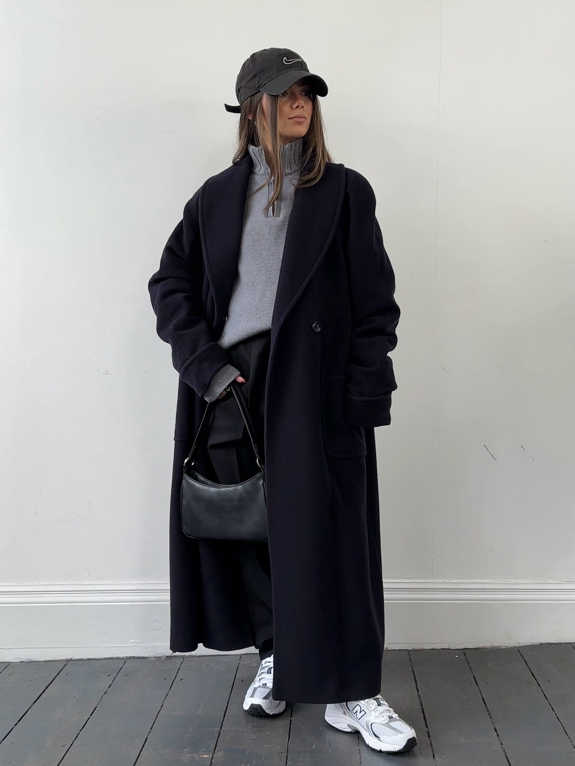 Vintage wool double-breasted coat in medium size, showcasing classic design and textured fabric, ideal for stylish winter wear.
