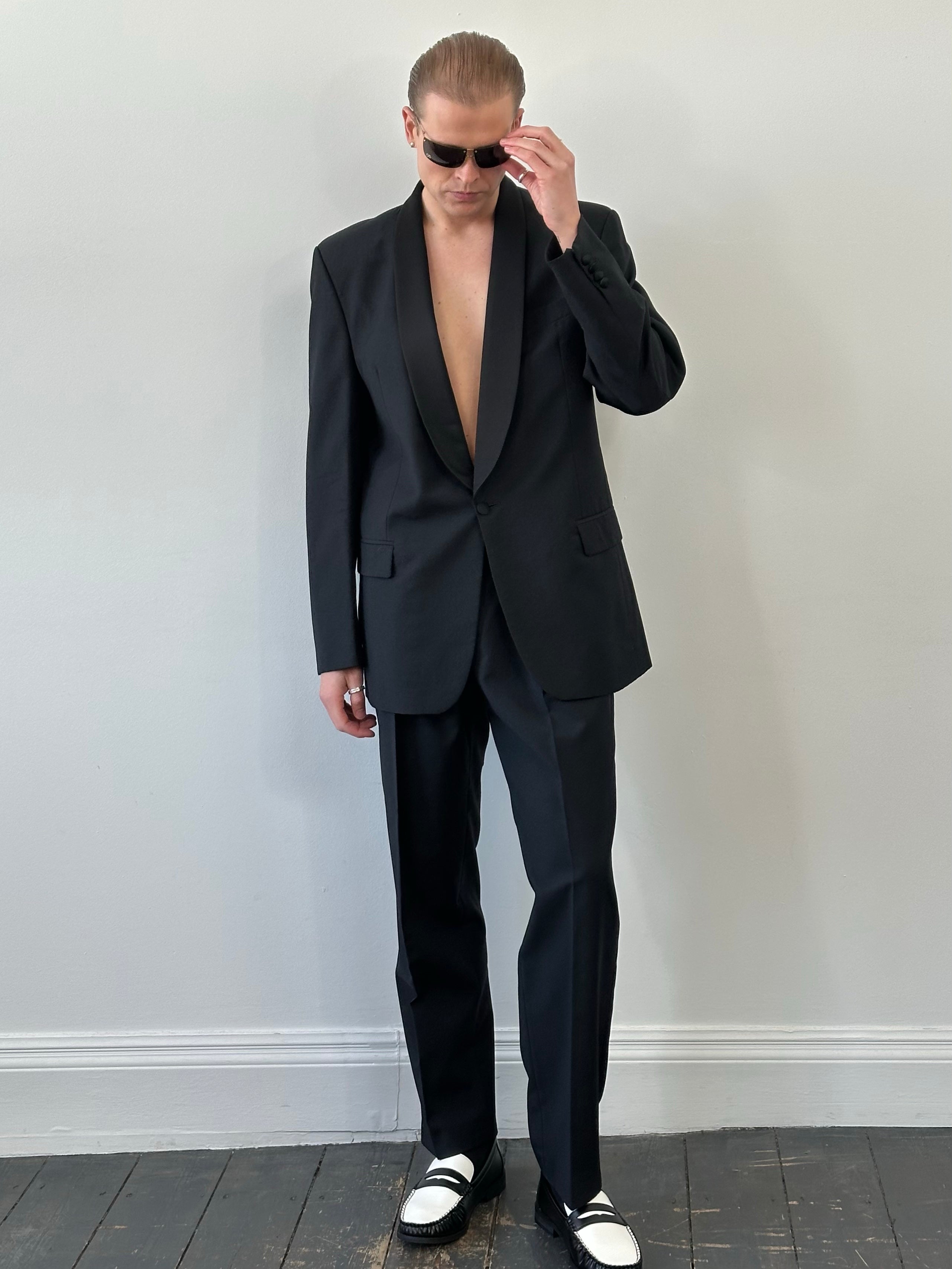 Pierre Cardin 1980s pure wool tuxedo suit with shawl collar, tailored fit, in dark color, featuring classic lapels and precise stitching.