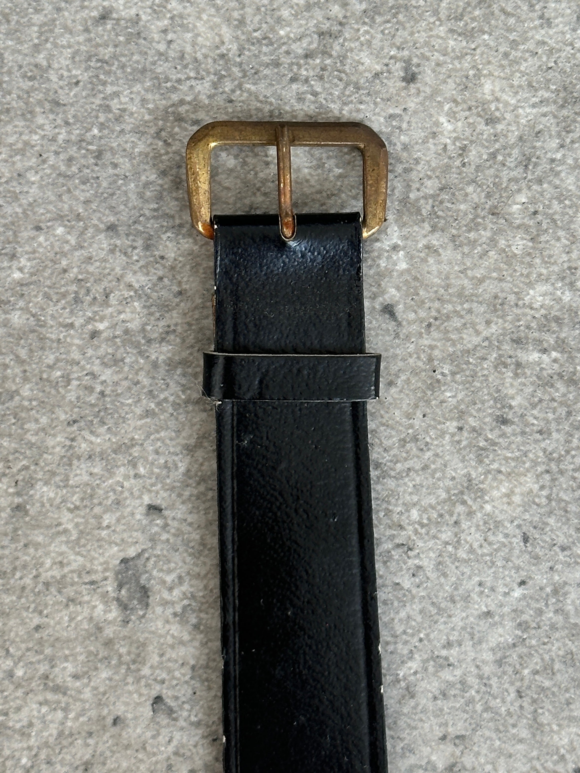 Vintage Swiss Made 1980s mechanical leather watch with classic design and detailed dial, showcasing timeless craftsmanship.