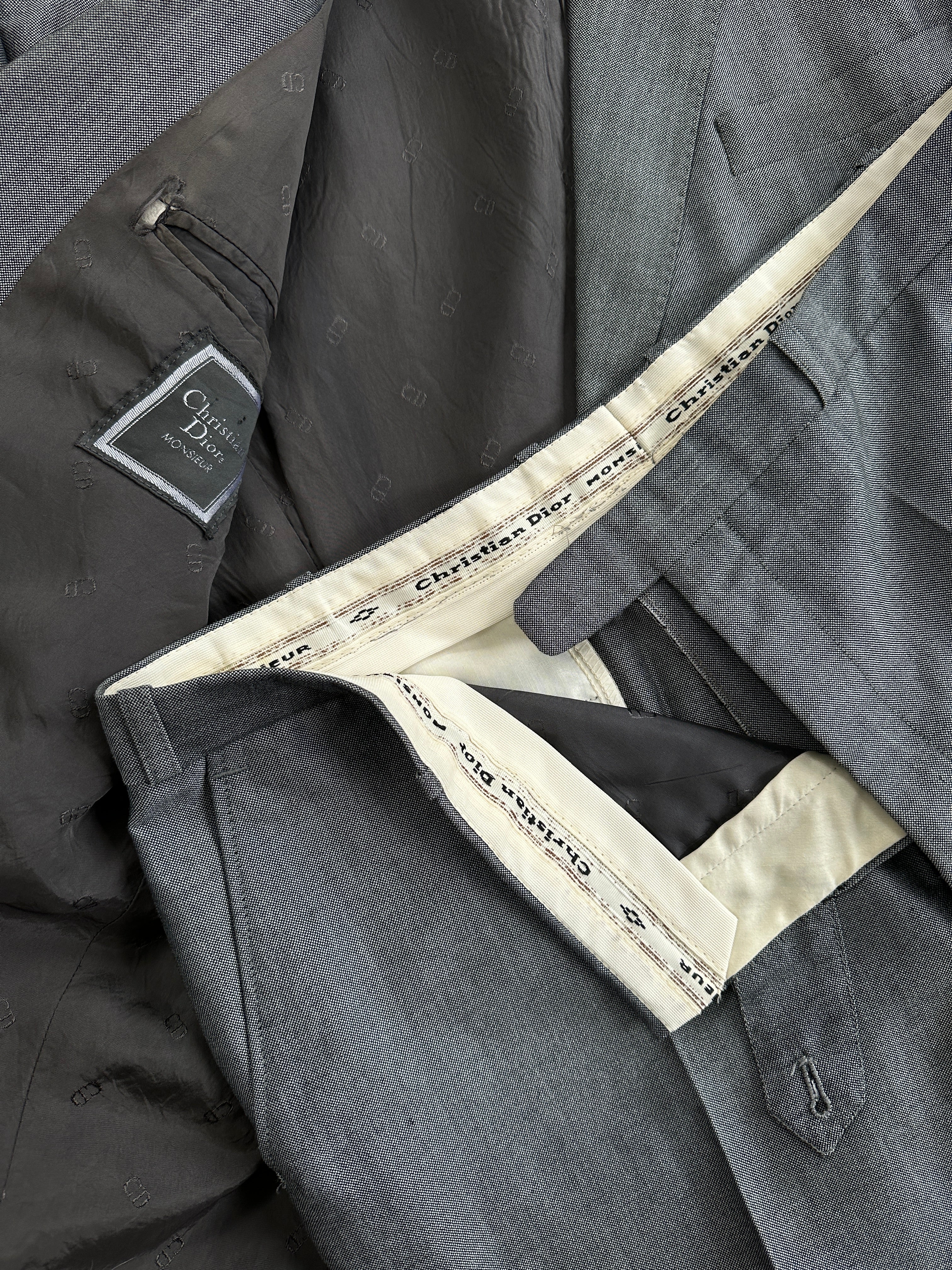 Christian Dior Monsieur wool single-breasted suit in size 44L/W36, shown as a tailored jumpsuit on a mannequin.