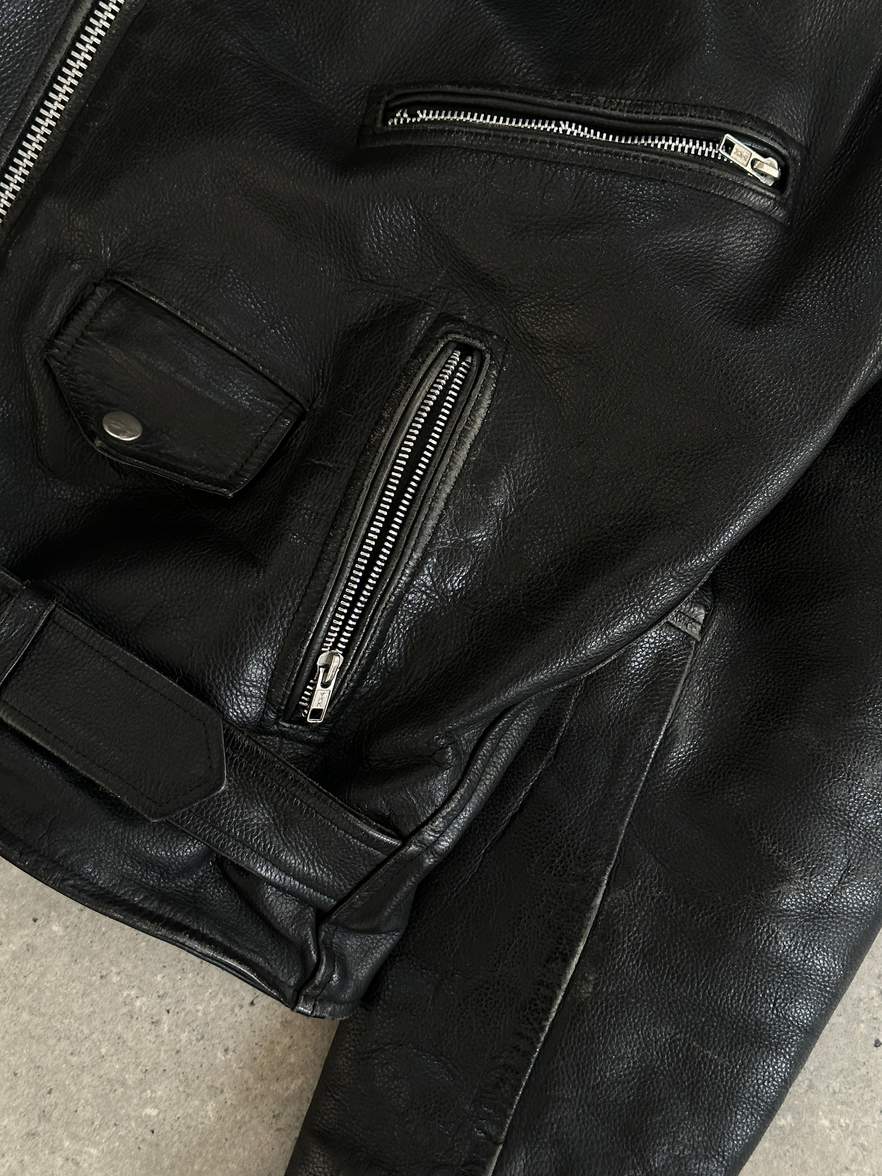 Vintage leather biker jacket in XL size with classic design, featuring a rugged, stylish look and detailed stitching.