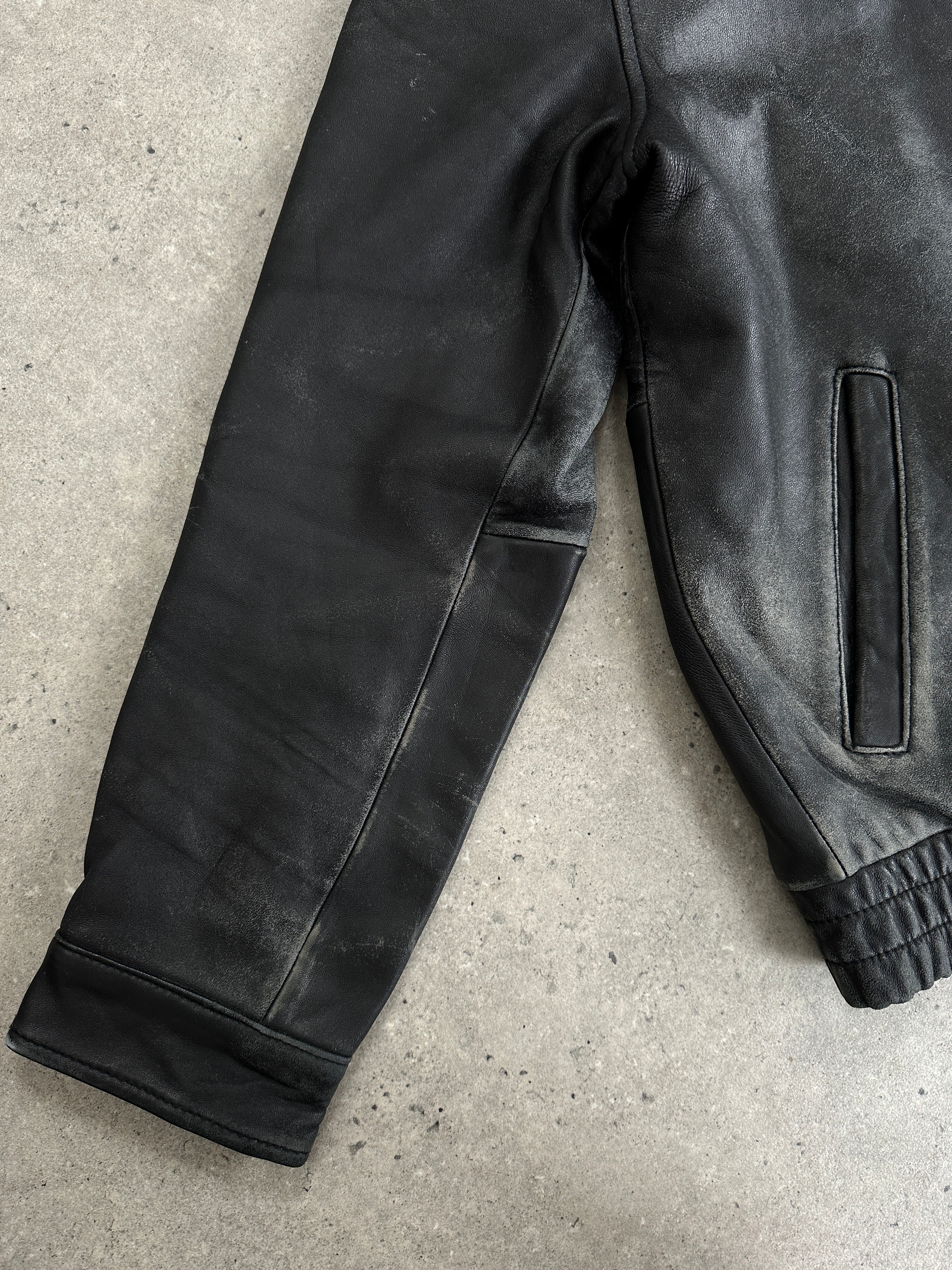 Tommy Hilfiger distressed leather bomber jacket in medium size with a rugged, stylish design and classic collar.