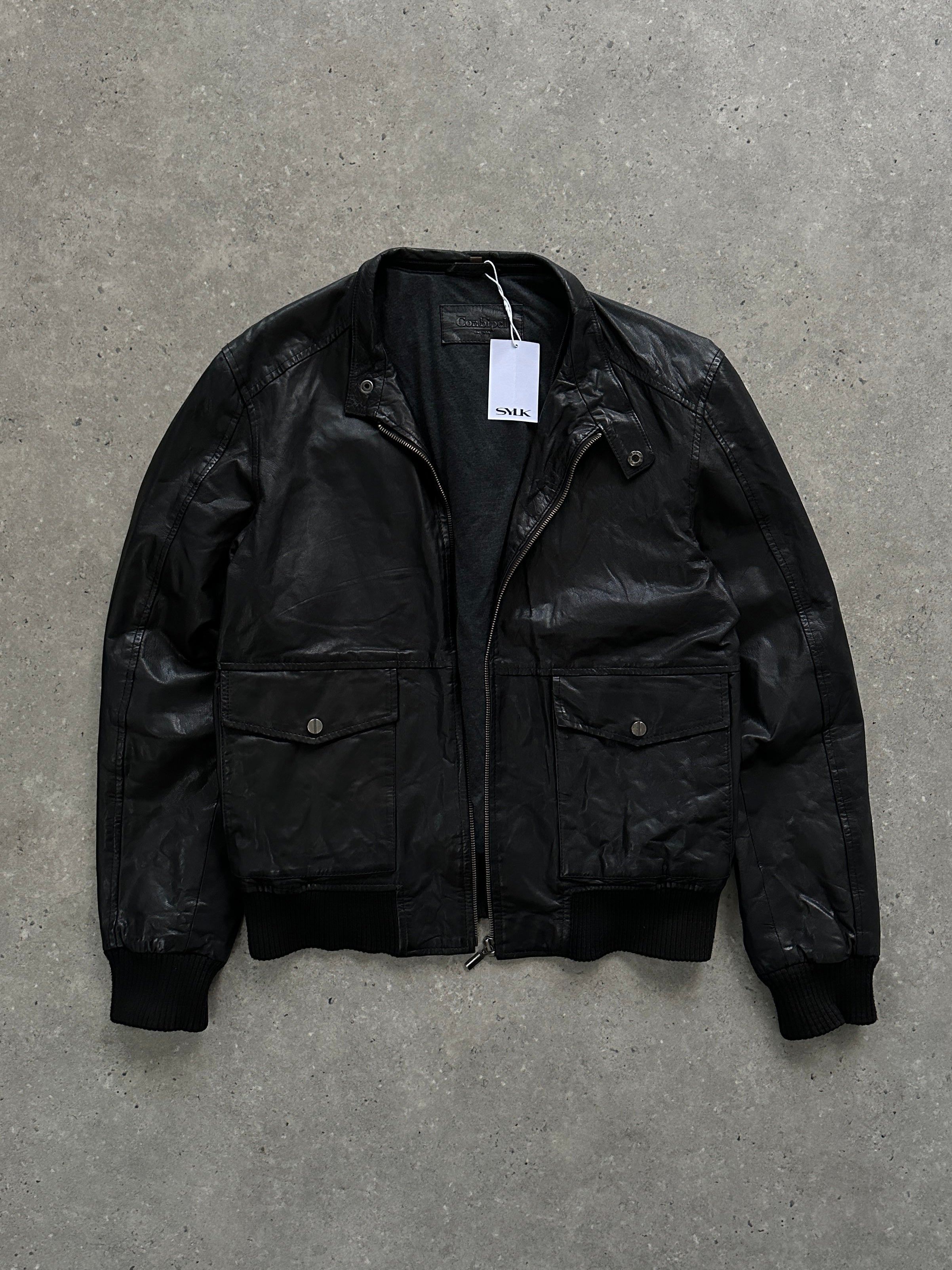 Conbipel moto leather bomber jacket in black, featuring a classic design with ribbed cuffs and collar, size S/M.