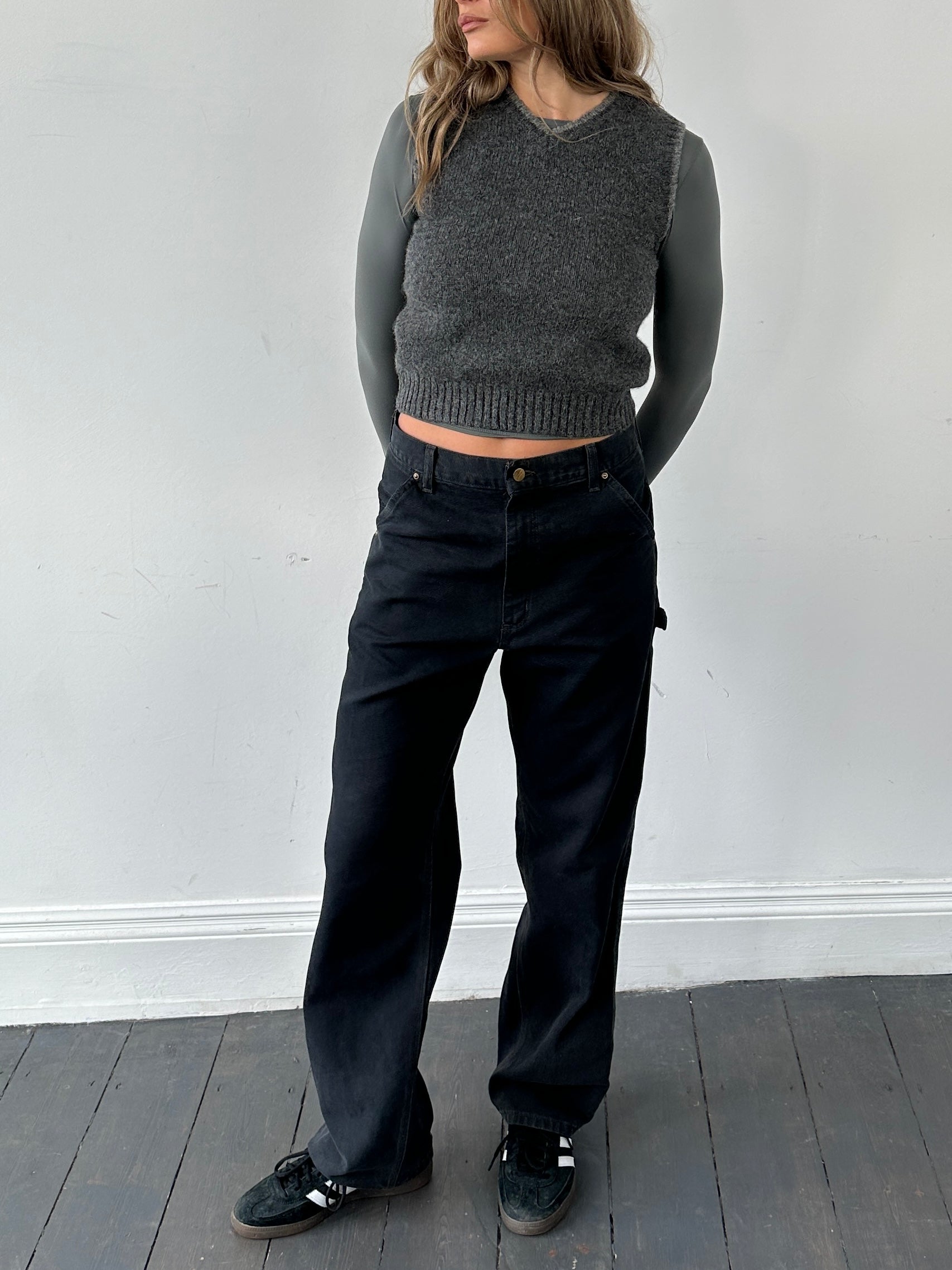 Carhartt high waisted cargo denim jeans in W30, showcasing classic blue denim with multiple cargo pockets and a high-rise fit.