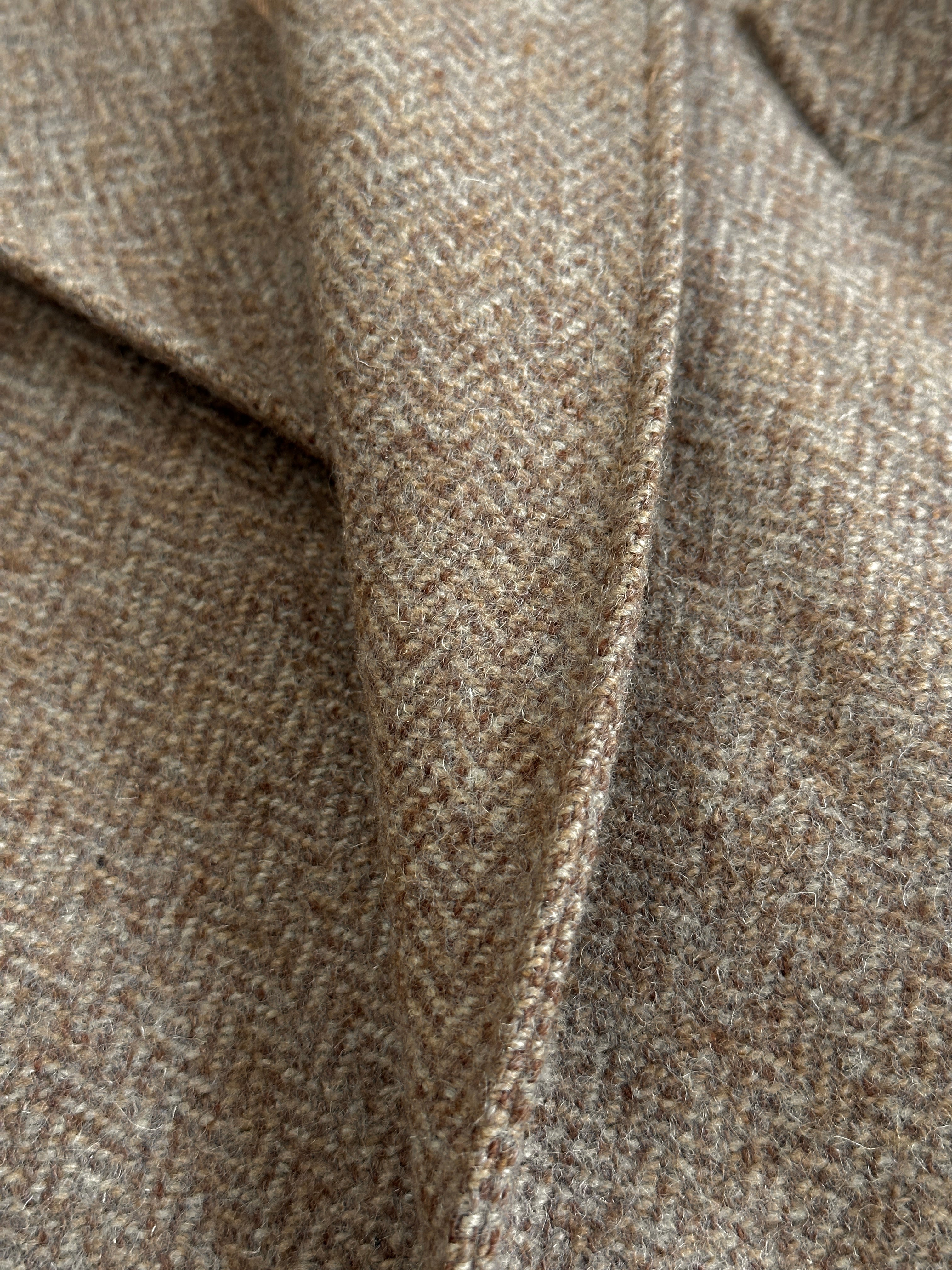 Vintage wool herringbone double-breasted coat in XL, showing classic style and textured fabric with button details.