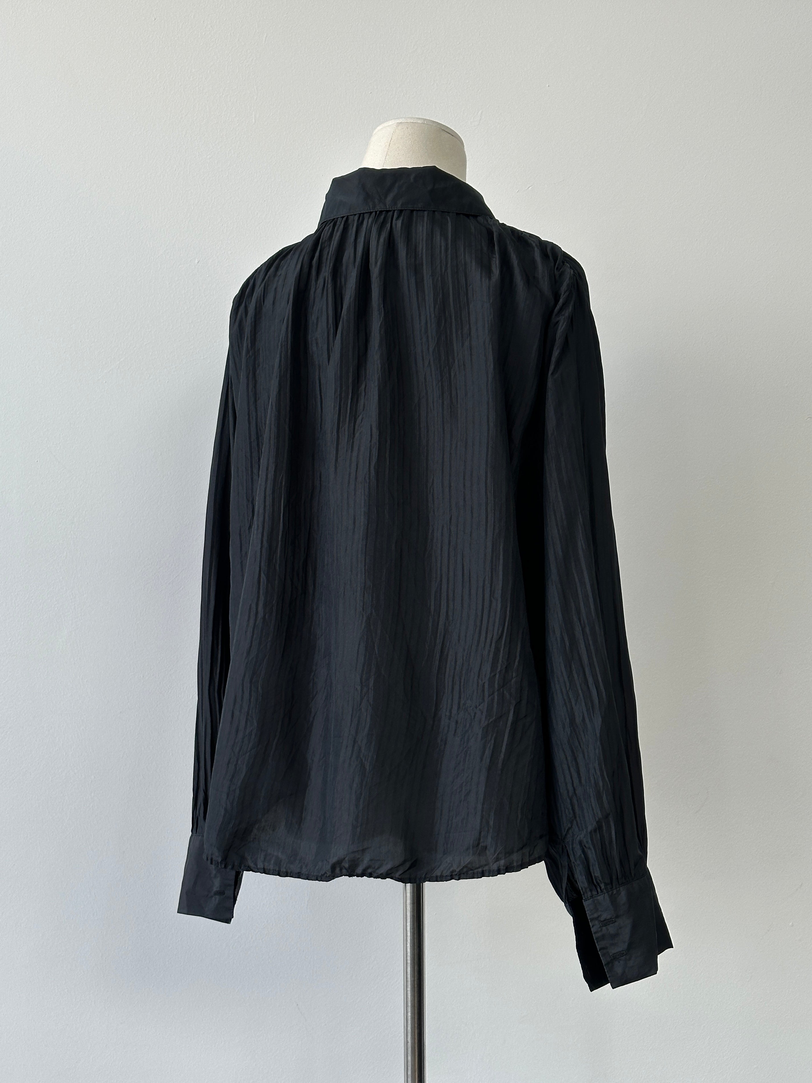 Vintage 1990s pure silk pleated shirt in size L, featuring elegant craftsmanship and classic design, shown on a hanger.