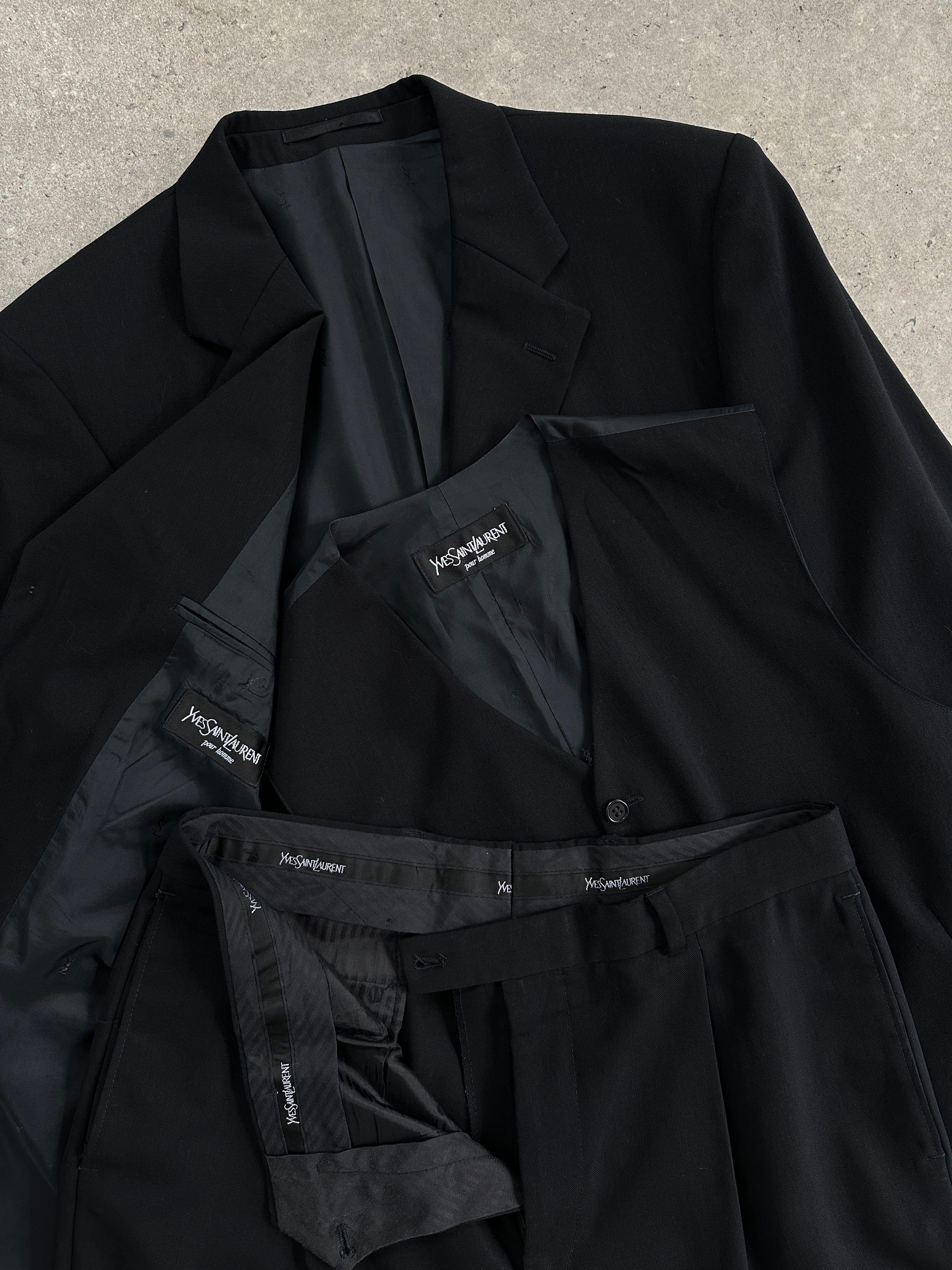 Yves Saint Laurent Pour Homme pure wool three-piece suit in size 40L/W32, tailored with a sleek fit and classic style.