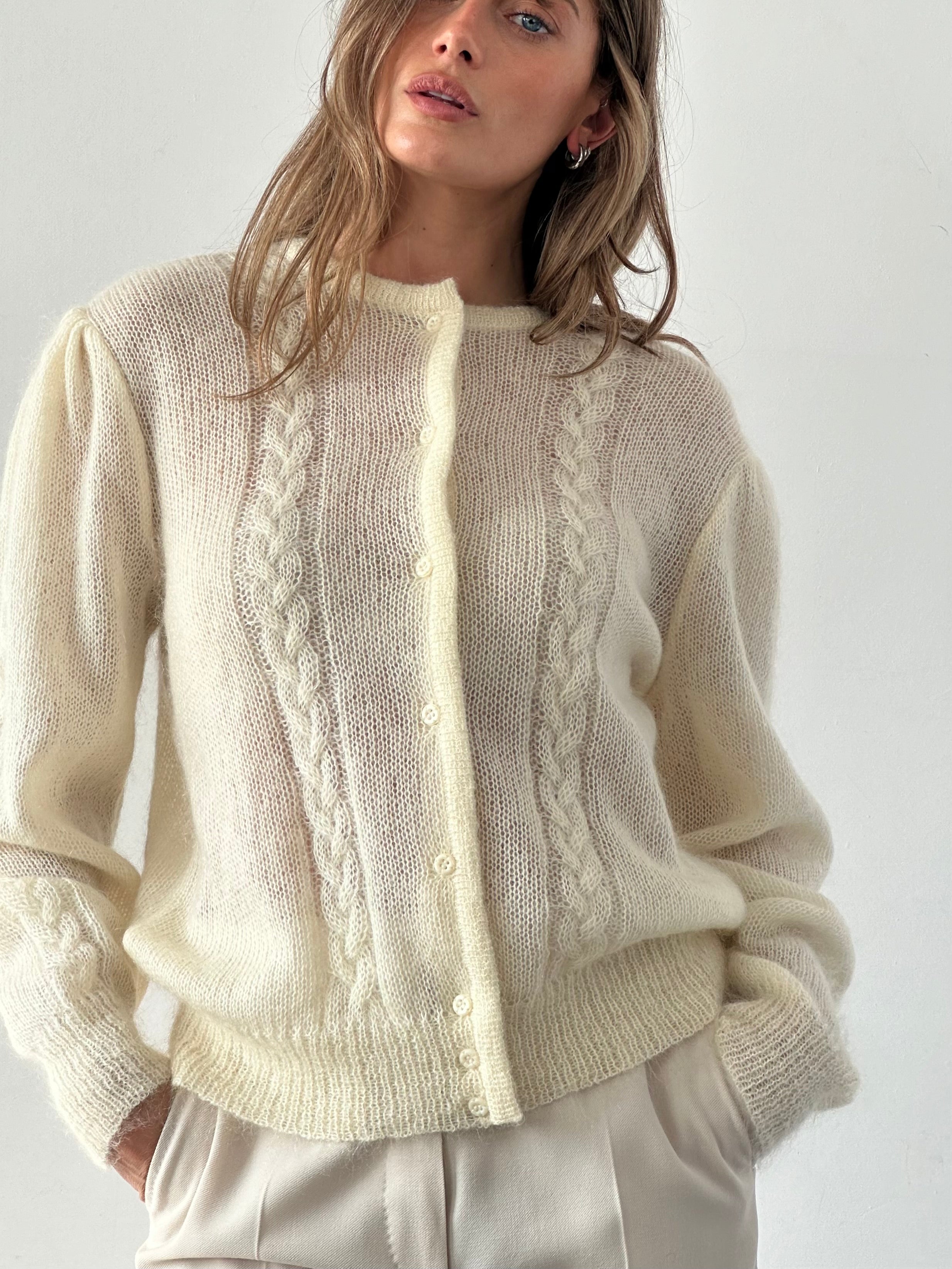 Vintage wool mohair cardigan in size L, featuring a classic design with button closures and cozy texture.