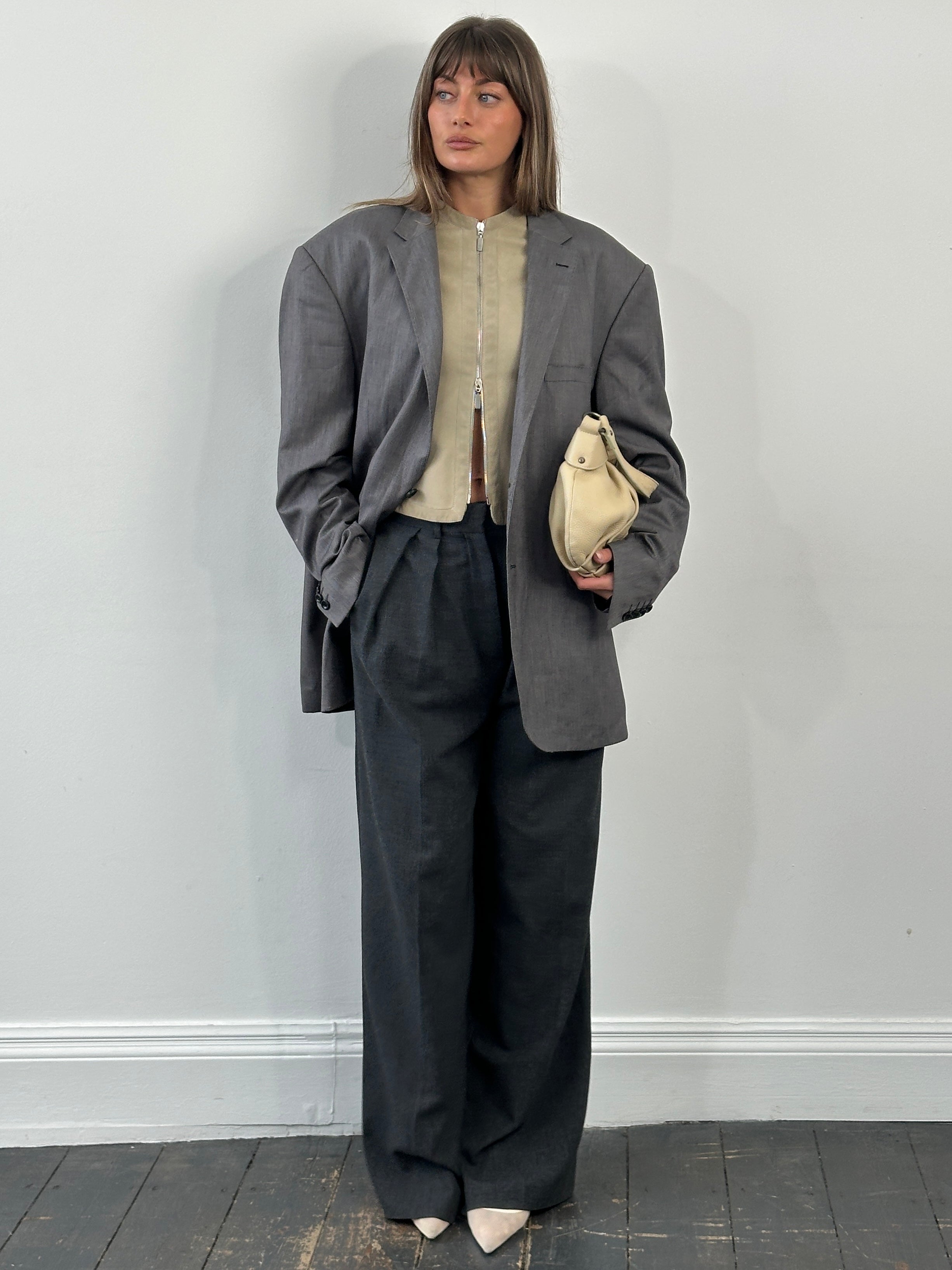 Loro Piana 1990s wool single-breasted blazer in size 50R/XXL, tailored with classic lapels and a rich textured fabric.