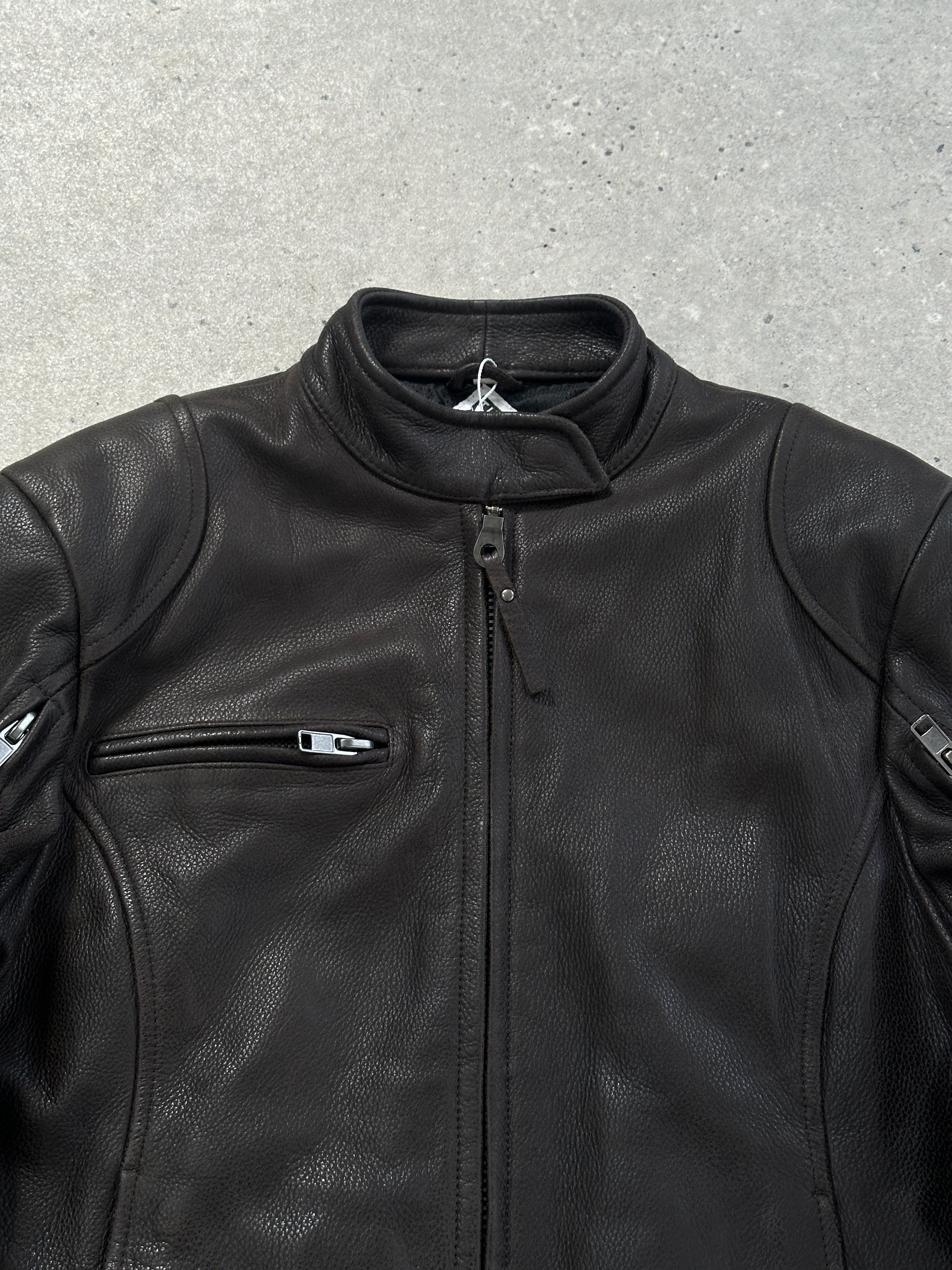 Vintage leather moto jacket in size S/M, featuring classic design and textured leather, perfect for a stylish, edgy look.