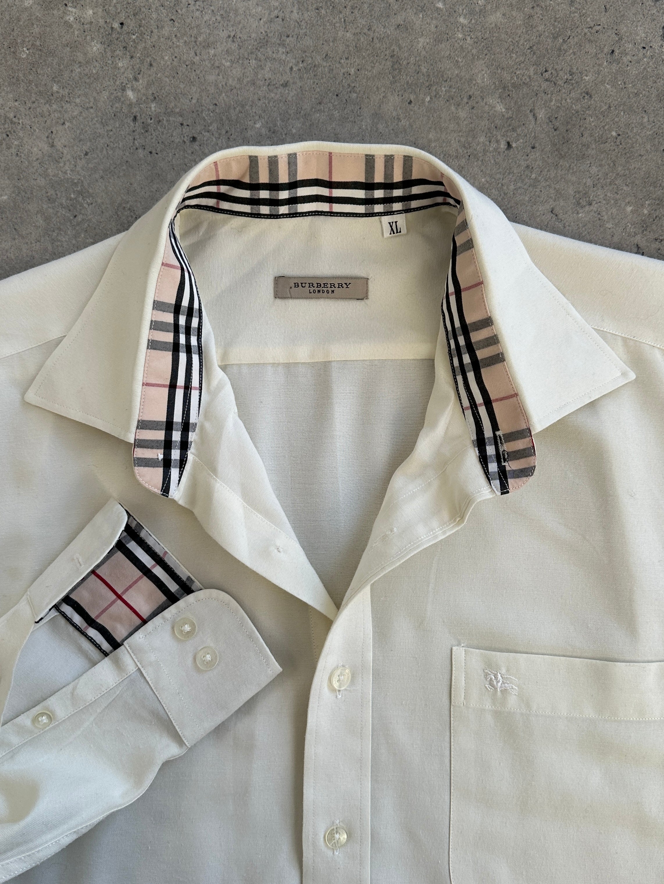 Burberry London 1990s cotton logo shirt displayed flat, featuring iconic Burberry check pattern and classic button-up design.