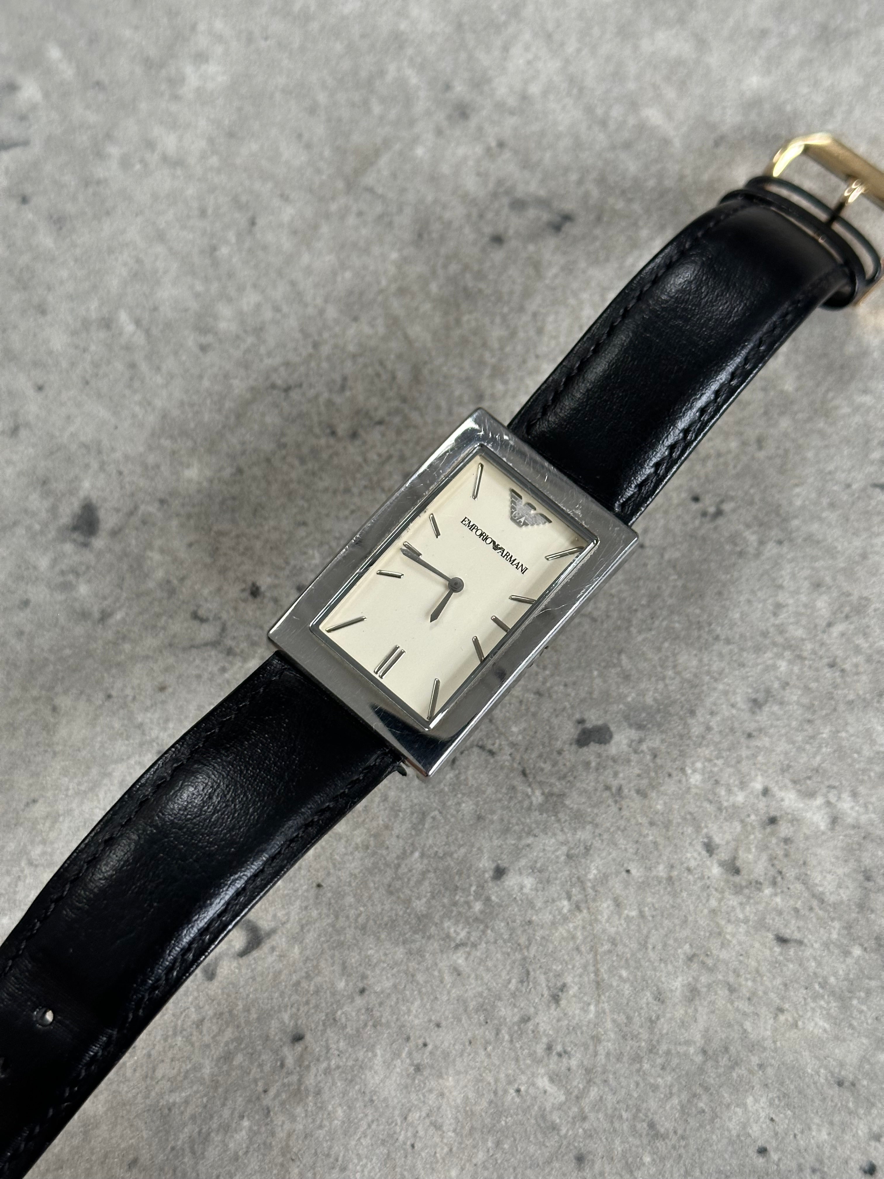 Emporio Armani stainless steel rectangular leather watch, 2000s style with silver-tone case and black leather strap.