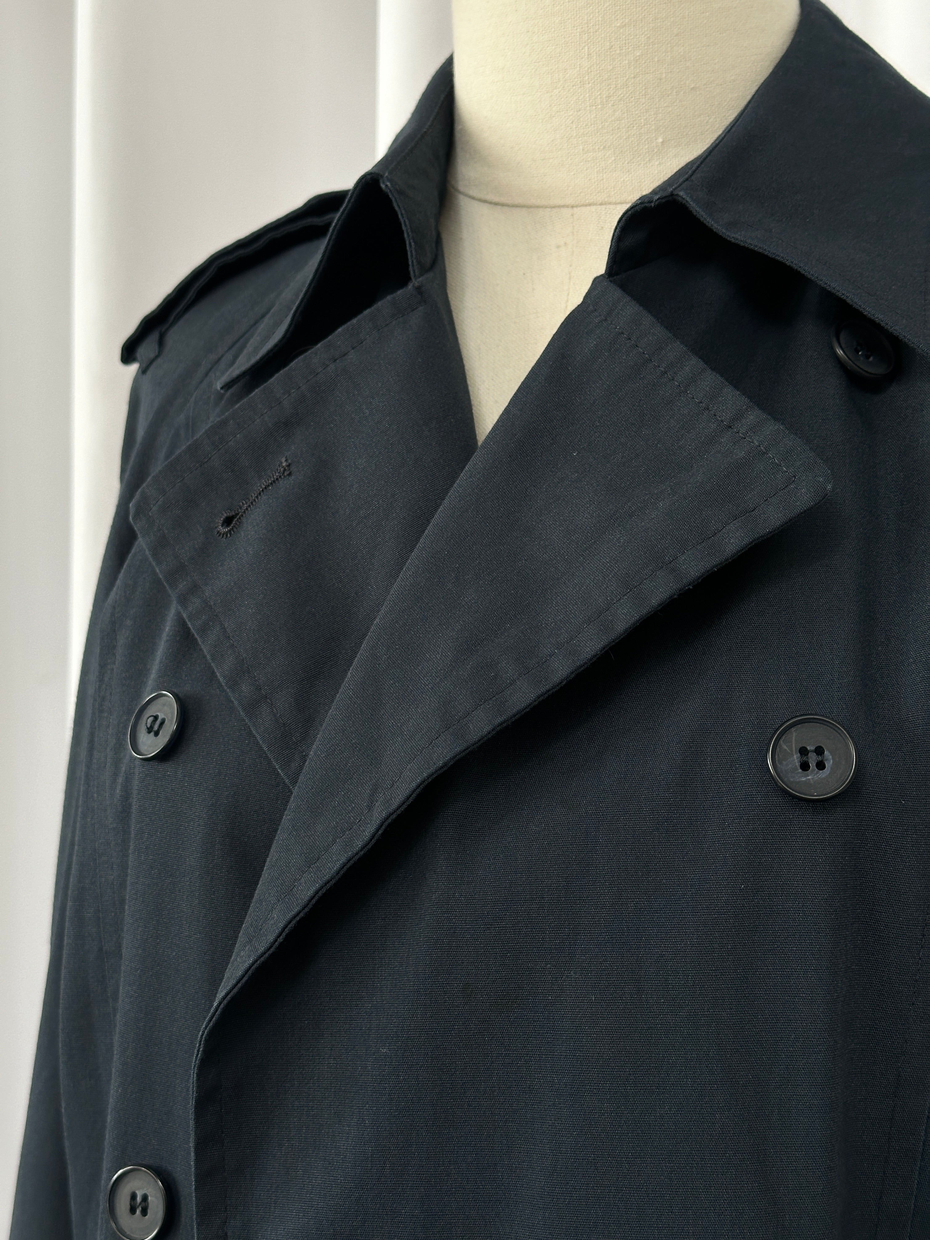 London Fog 1980s double-breasted cotton trench coat in size S displayed on a hanger, showcasing classic style and beige color.
