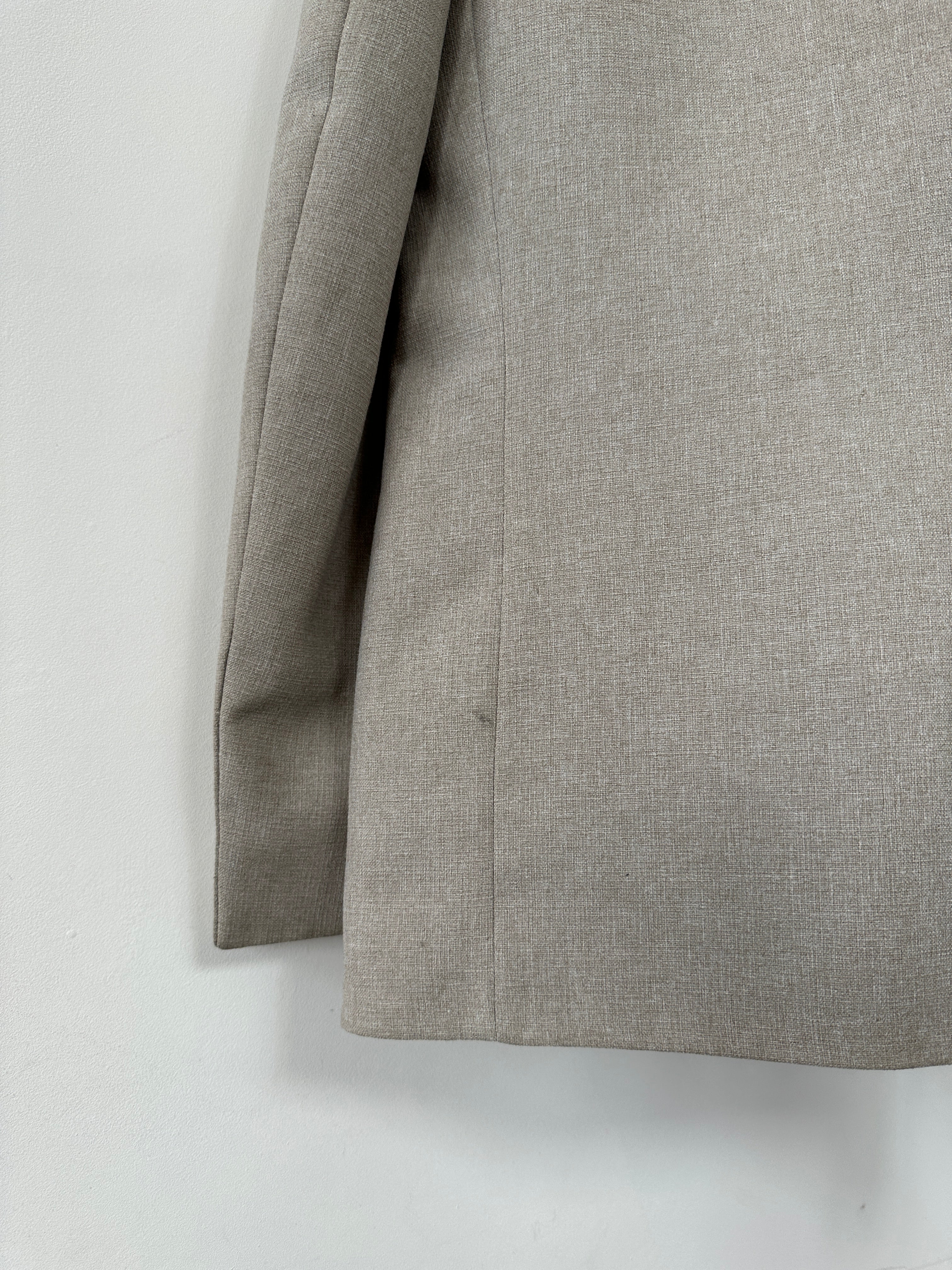 Vintage British vintage minimal blazer in size L, featuring classic tailored design and neutral fabric, ideal for smart casual styling.