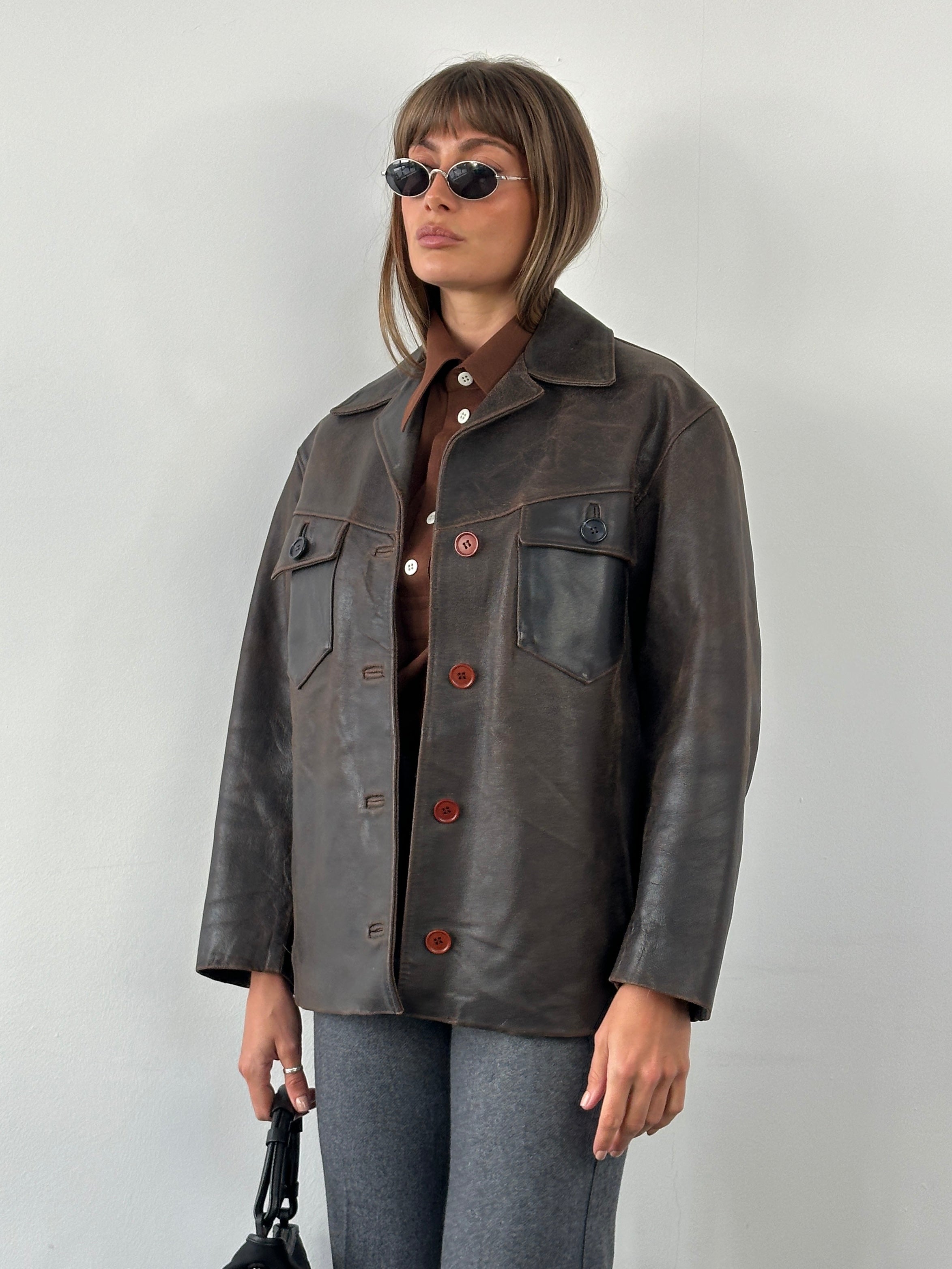 Conbipel 1970s Italian aged leather jacket in size M/L, featuring a classic vintage design with a rich, textured leather finish.