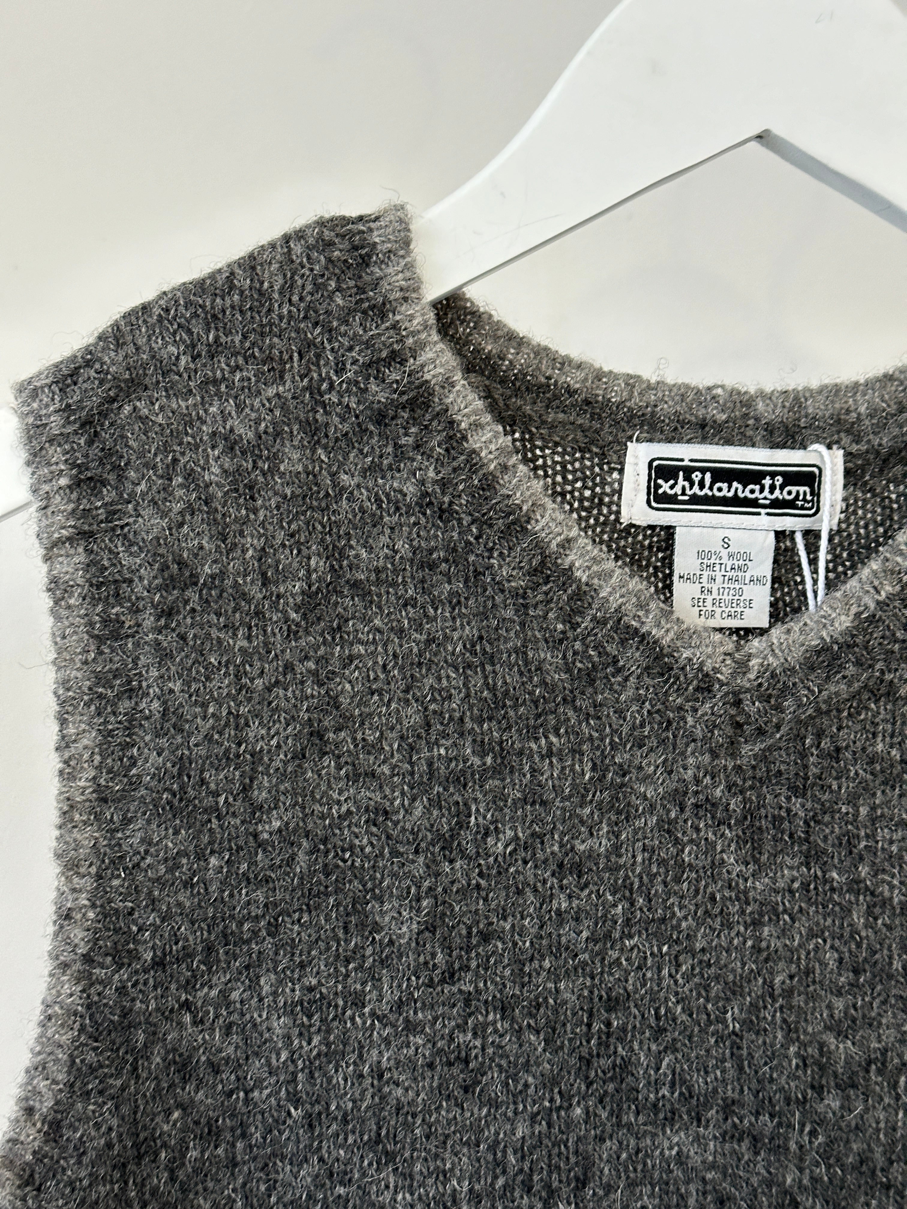 Vintage pure Shetland wool sleeveless vest jumper, size S, featuring a classic knit design and natural wool texture.