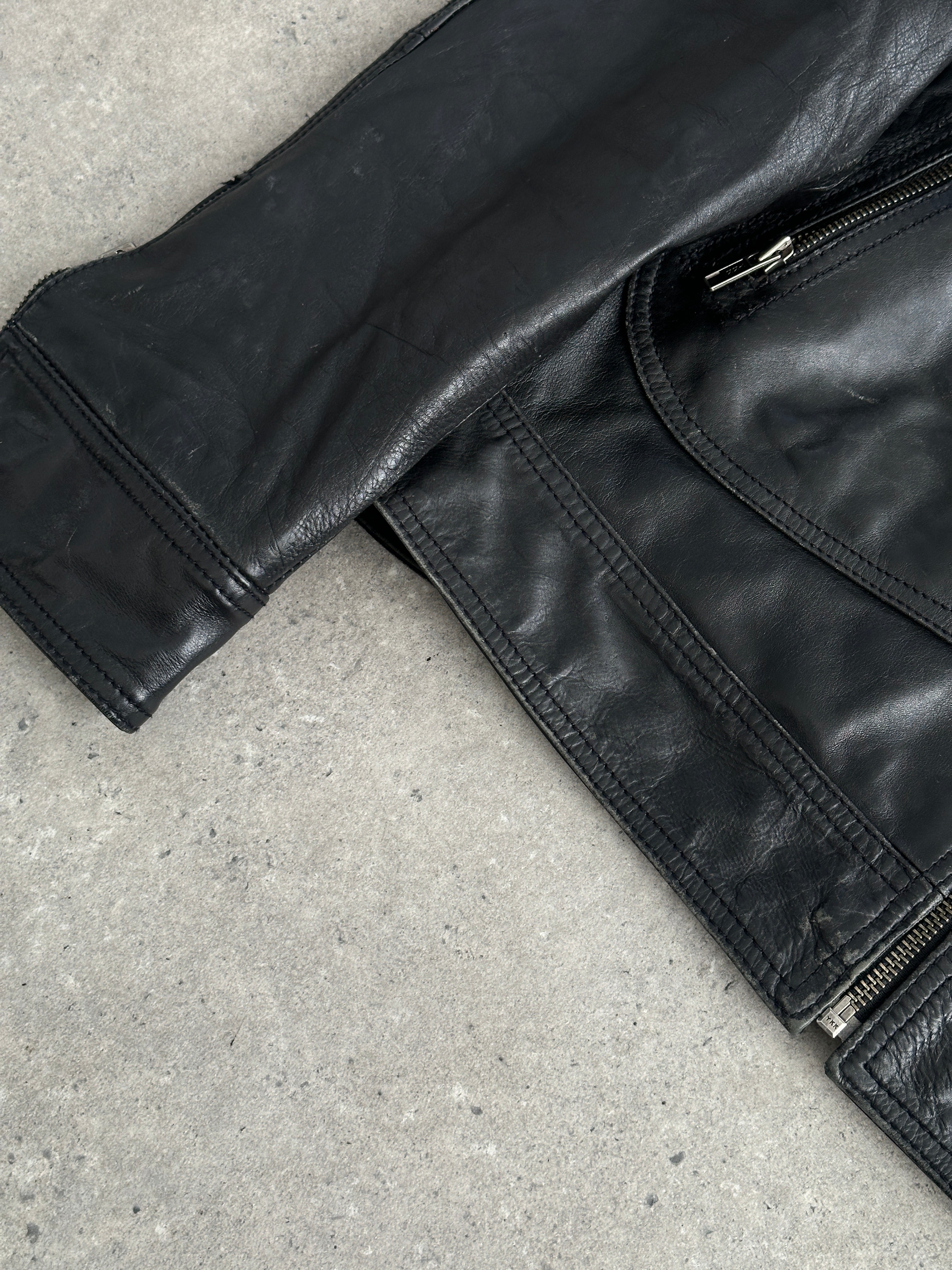 Conbipel high neck leather jacket in size M, featuring a sleek black design with a high collar and smooth leather texture.