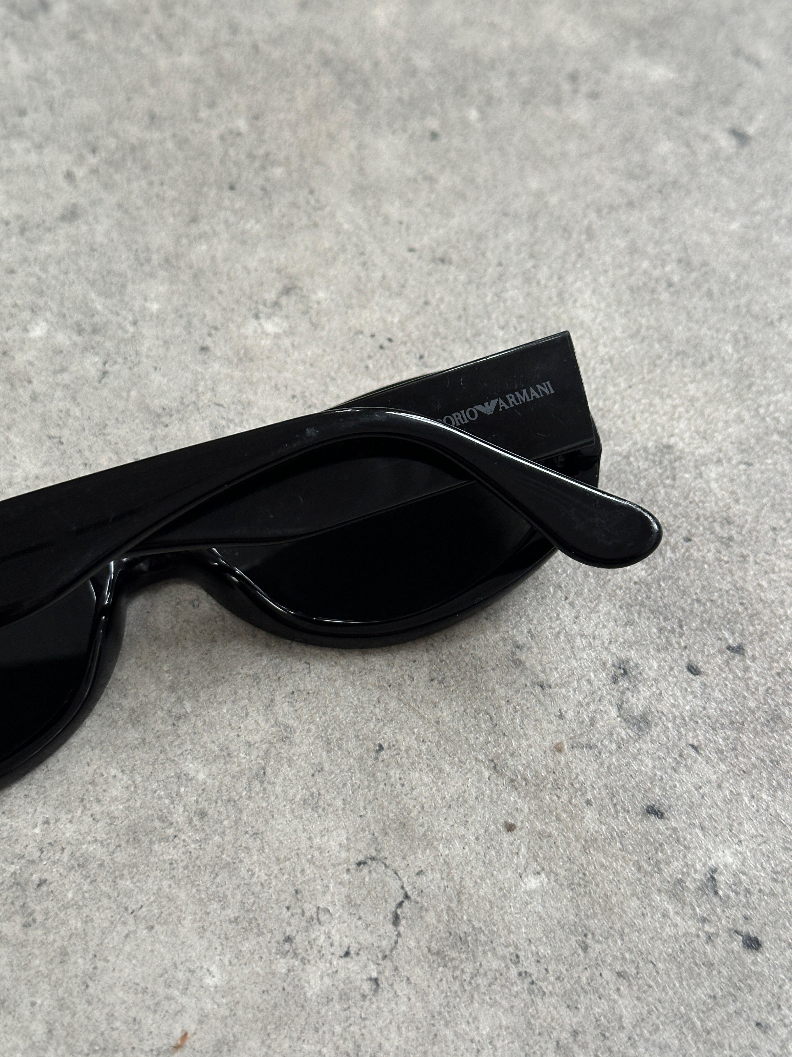 Emporio Armani 2000s oval sunglasses with dark tinted lenses and sleek black frames, stylish and iconic eyewear.