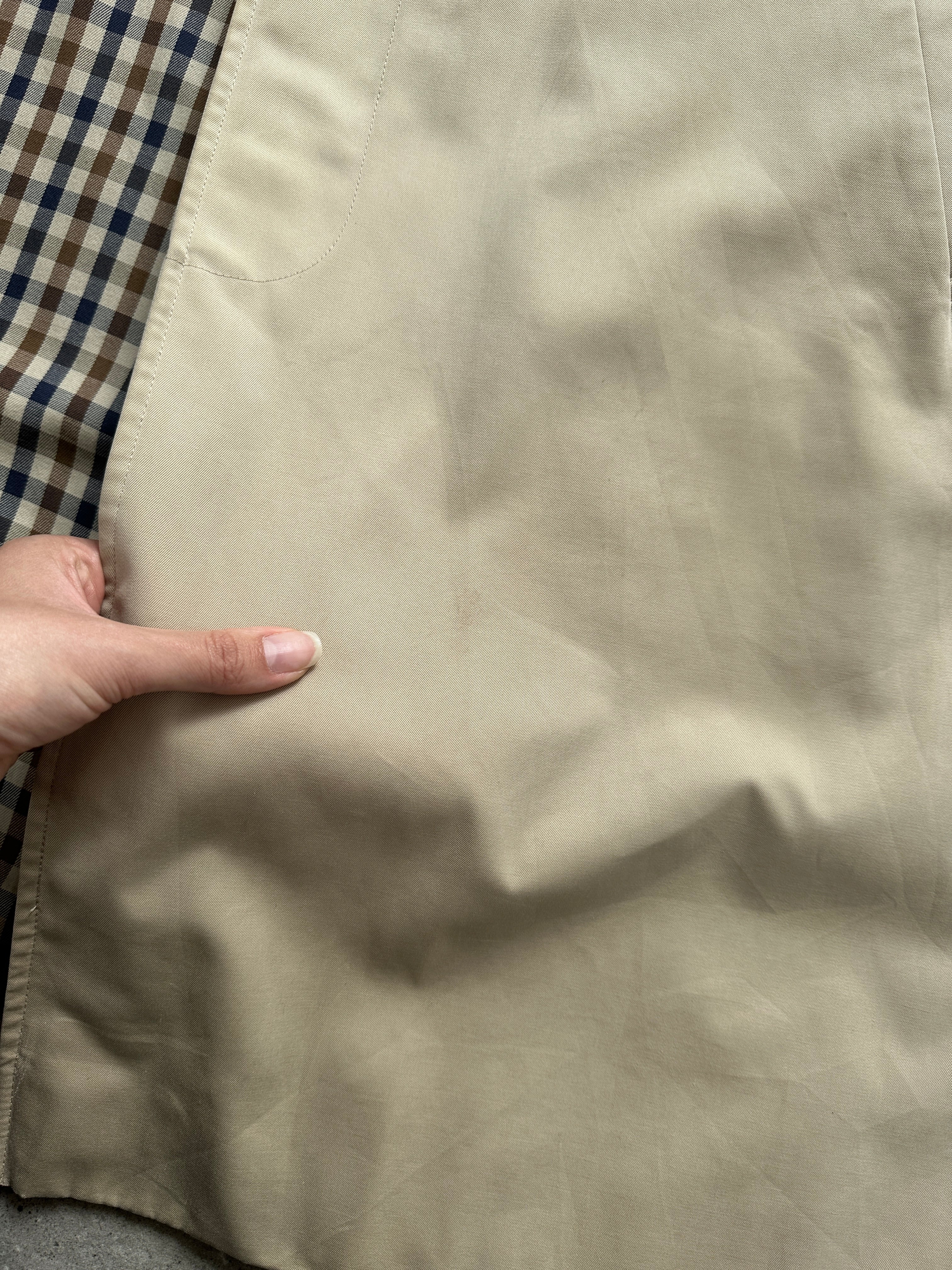 Aquascutum pure cotton belted trench coat with concealed placket in size L, classic beige color, tailored fit, and waterproof fabric.