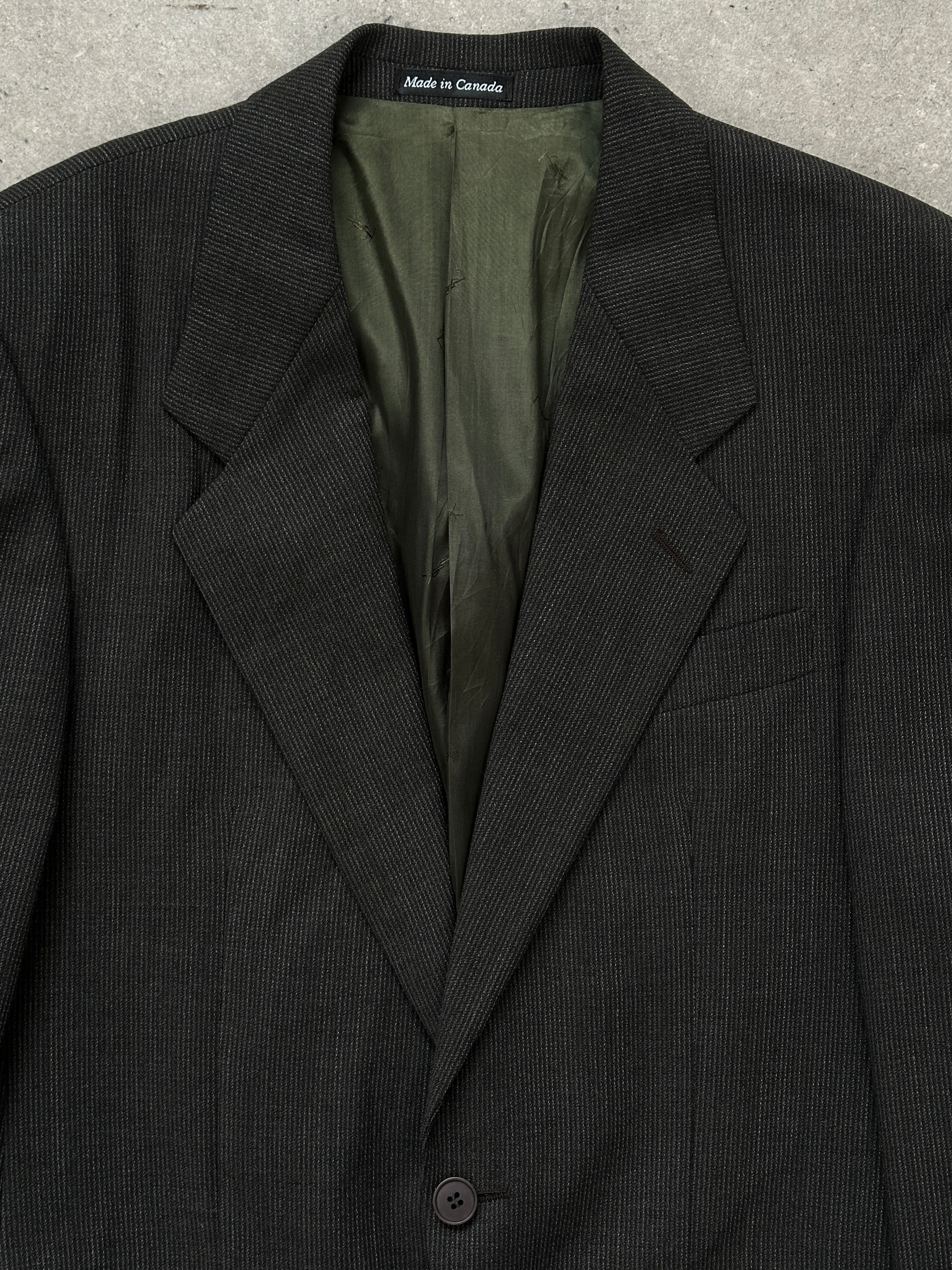 Yves Saint Laurent 1990s pure wool single-breasted blazer in size 40R/M, tailored fit with classic lapel and button closure.