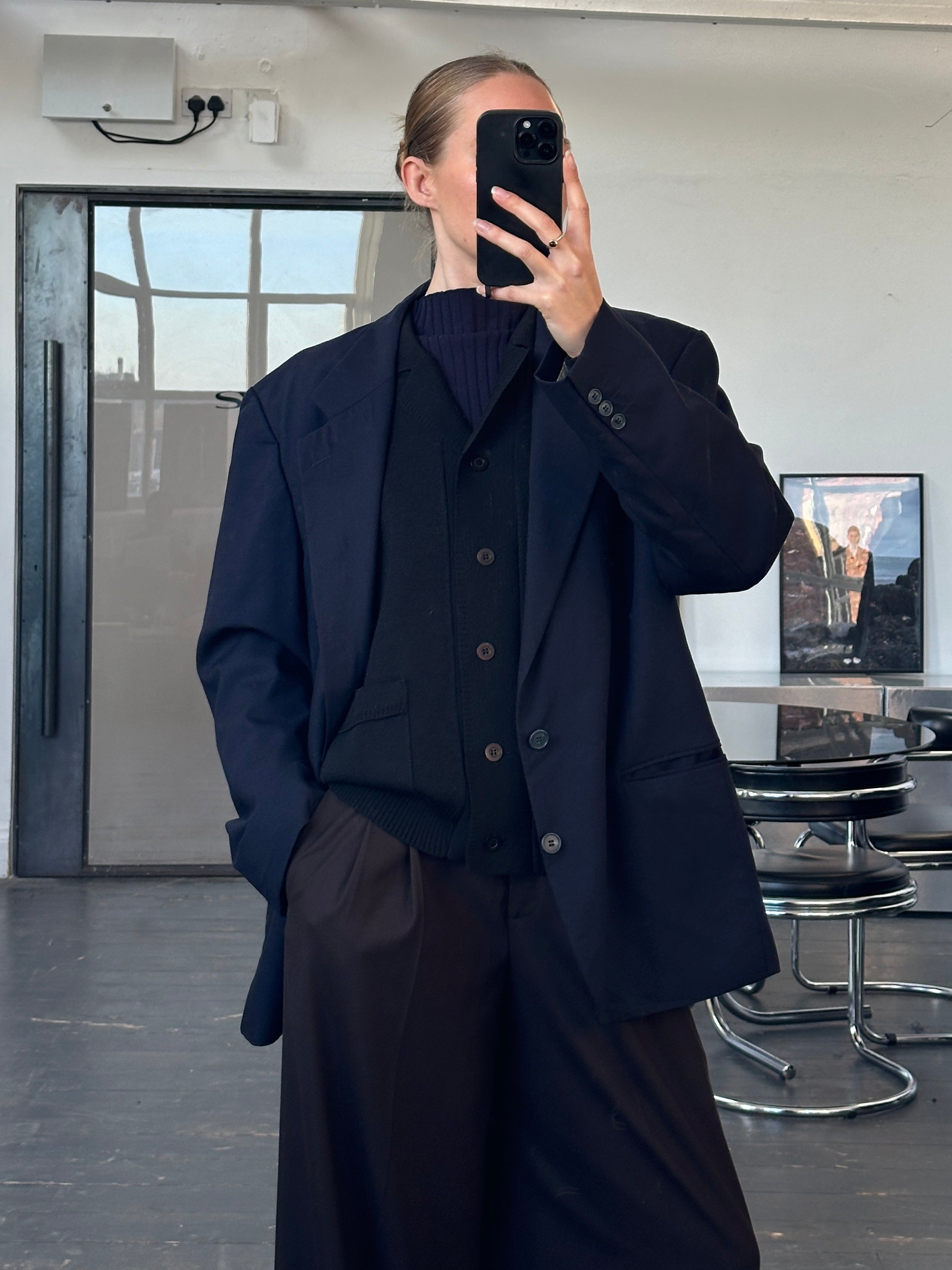 Yves Saint Laurent men's 1990s pure wool single-breasted blazer in size 44R/XL, shown on a hanger with a classic lapel design.