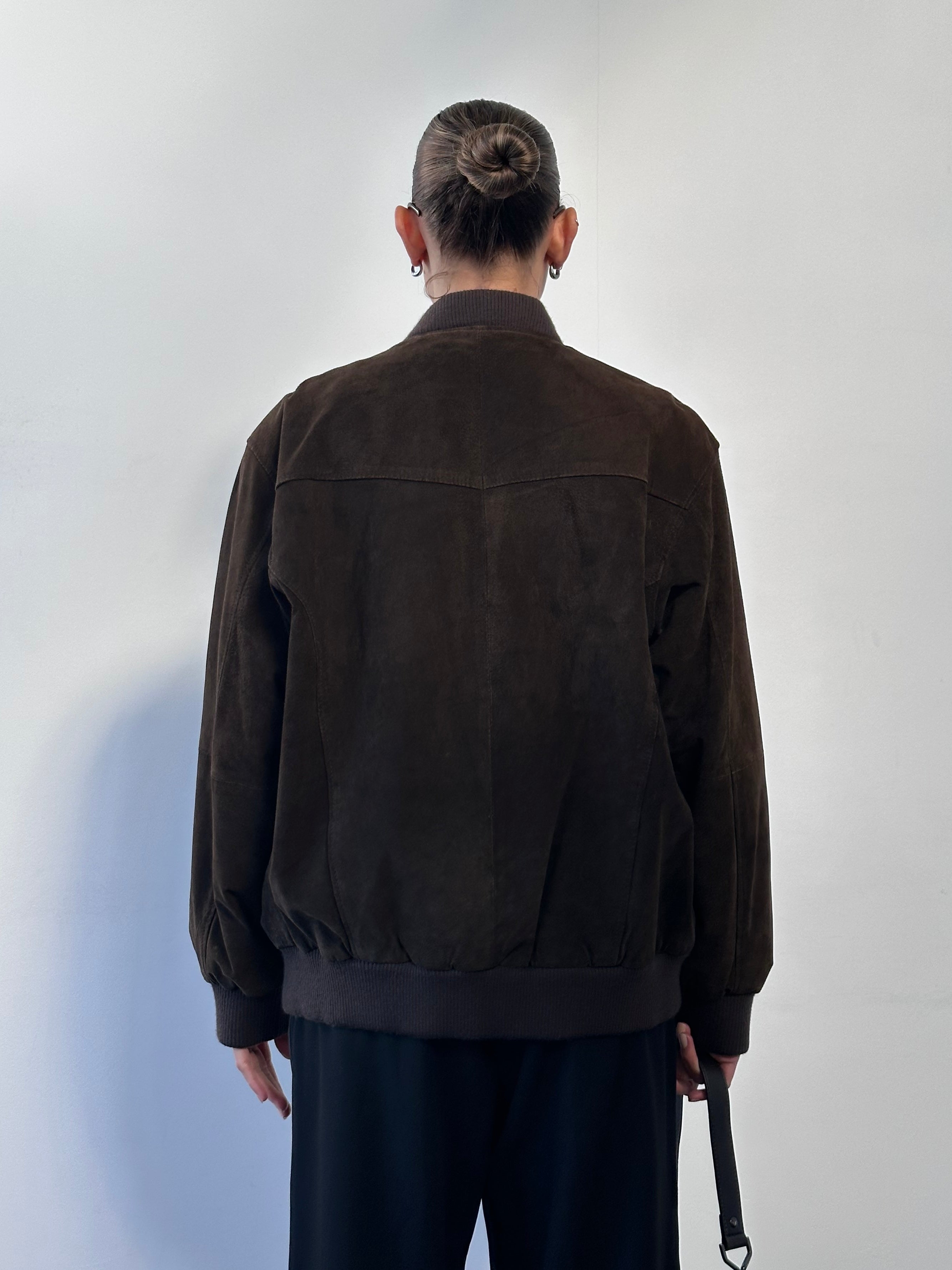 Vintage leather bomber jacket in suede, size large, featuring classic style and textured material.