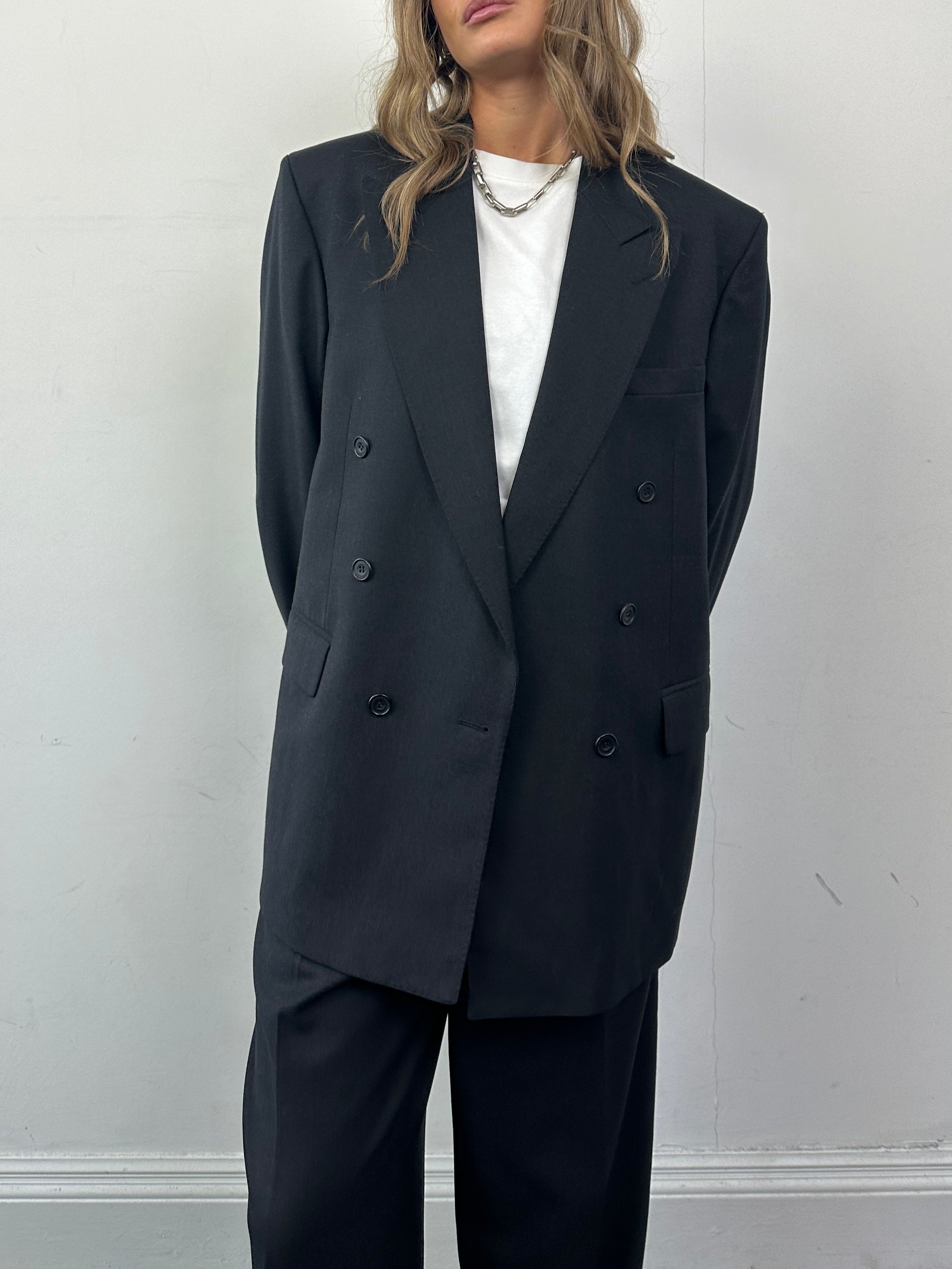 Christian Dior pure wool double-breasted suit jumpsuit in size 42R/W30, tailored fit with lapel collar and front buttons.
