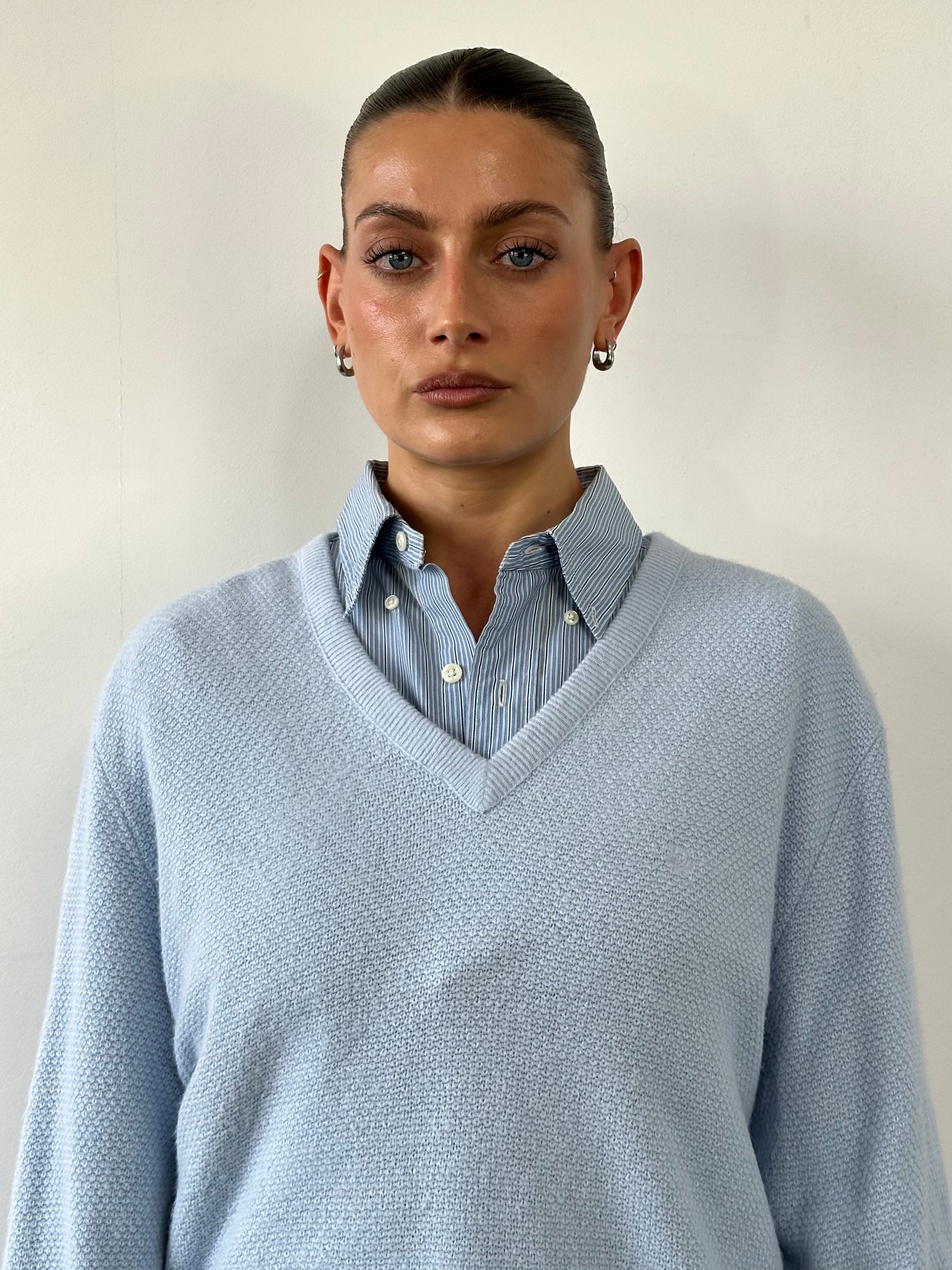 Christian Dior 1980s V-neck logo knitted jumper in size L, featuring a classic design with Dior branding and a cozy knit texture.