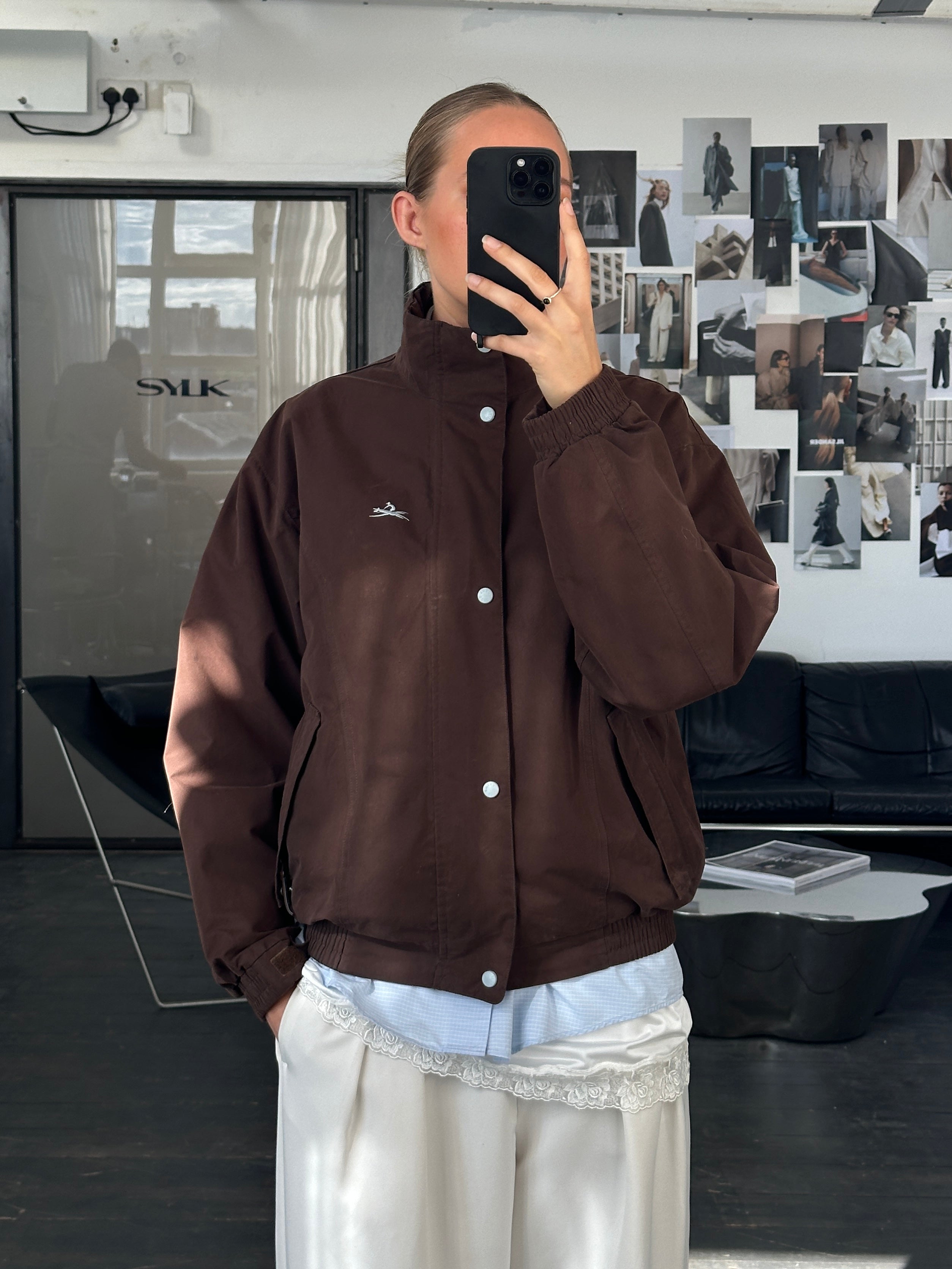 Vintage 2000s double zip boxy bomber jacket in black with short sleeves and front pockets, casual style for men or women.