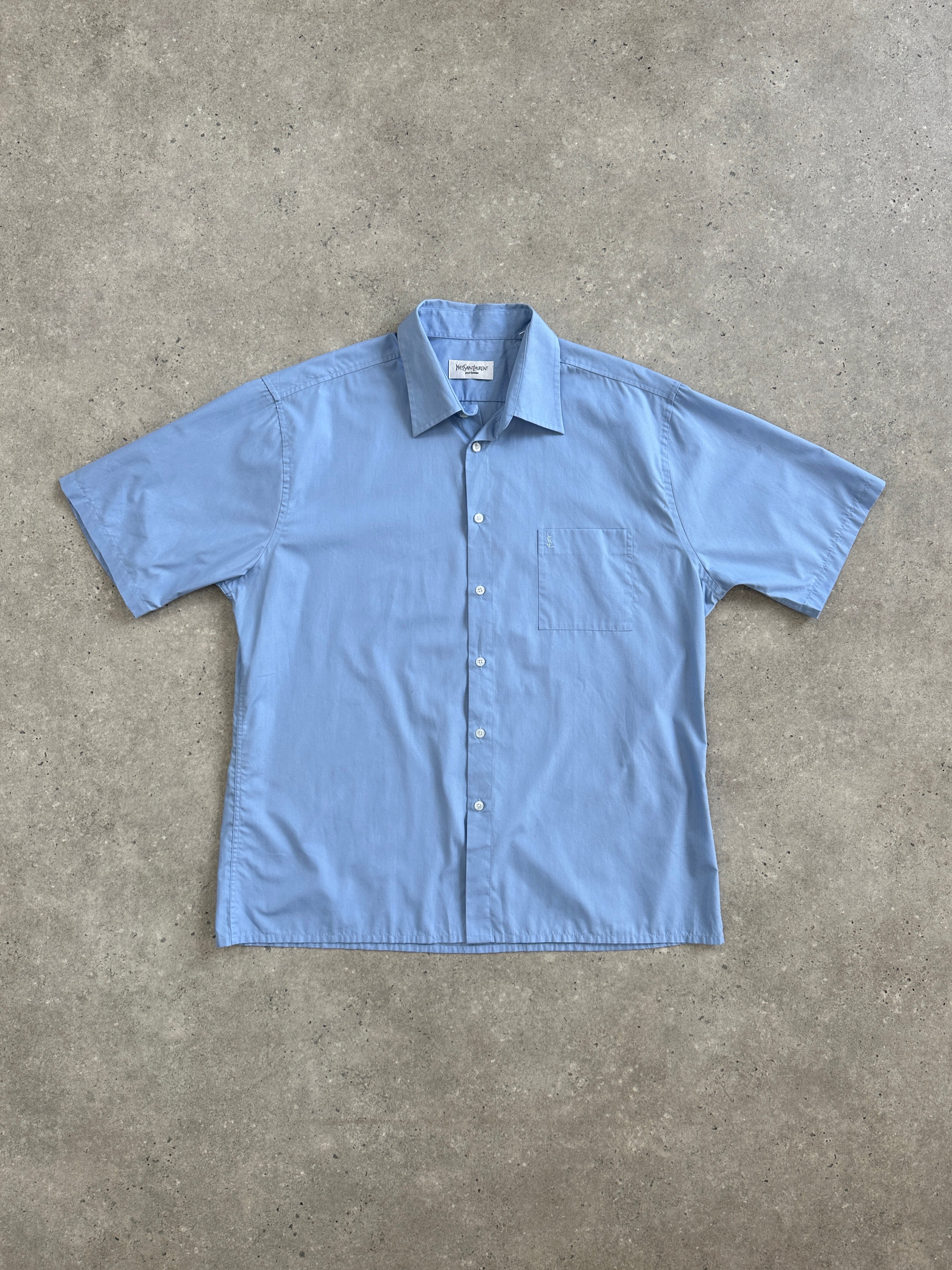 Yves Saint Laurent Pour Homme cotton short sleeve logo shirt in size L/XL, white with YSL branding on the front.