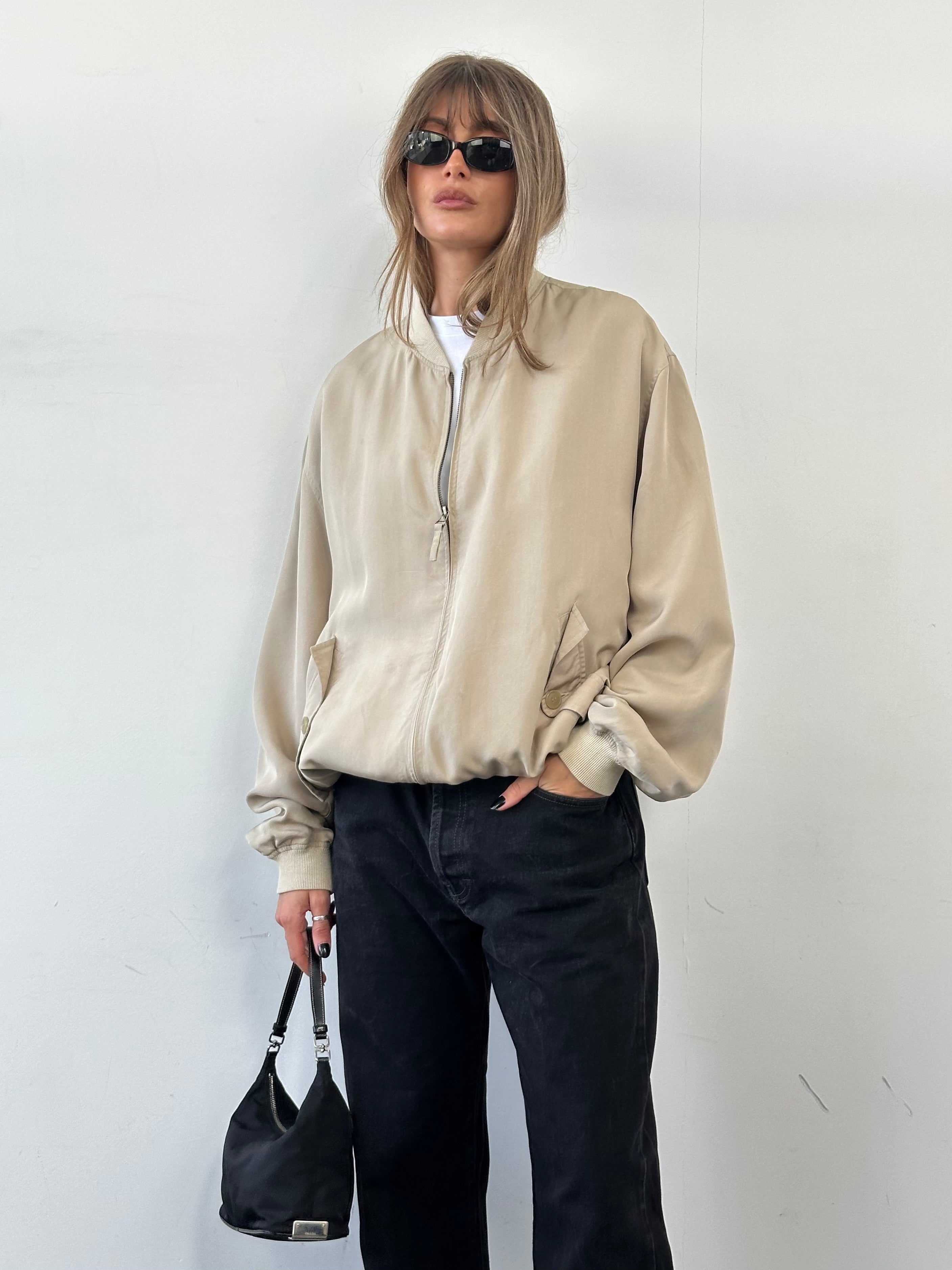 Vintage pure silk bomber jacket in size XL, featuring a classic style with smooth silk fabric and a sleek, timeless design.
