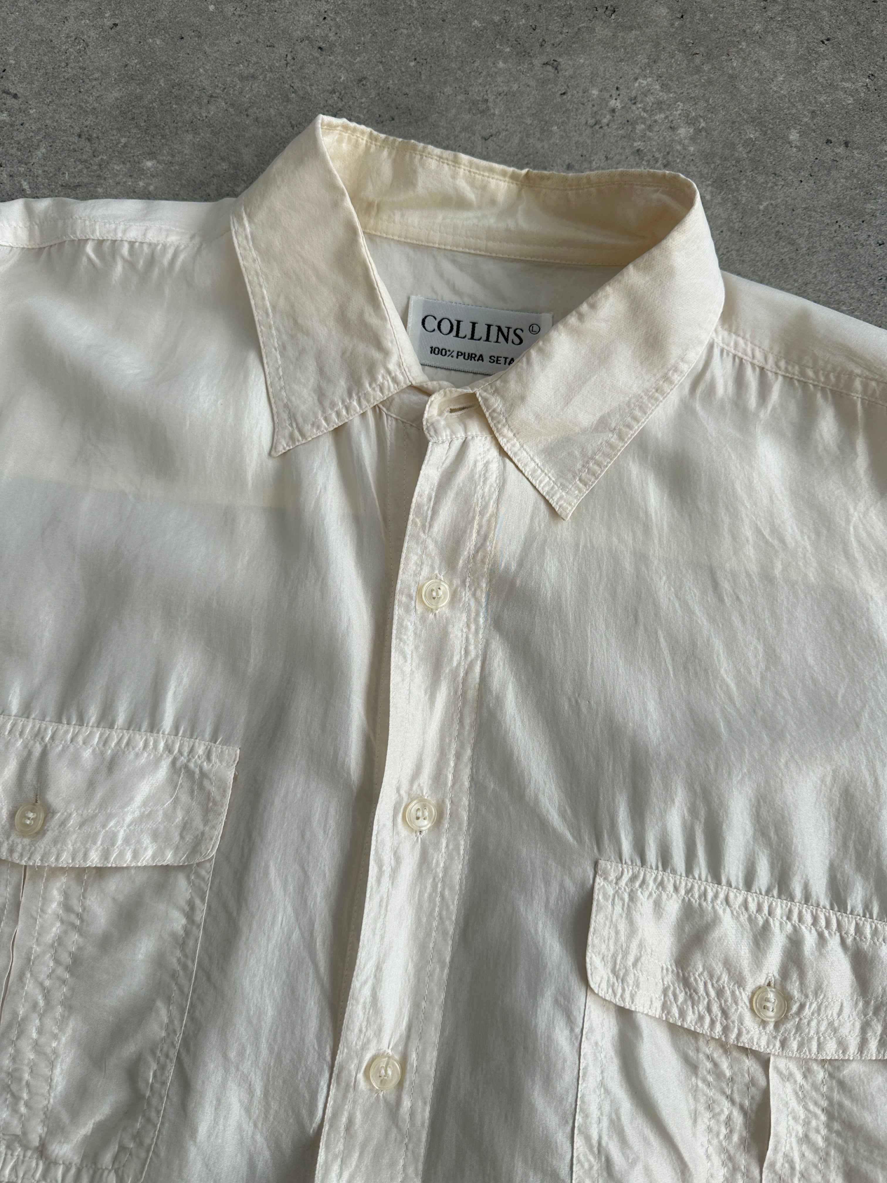 Vintage pure silk short sleeve shirt in XL, lightweight and elegant with a classic design, shown in this image.