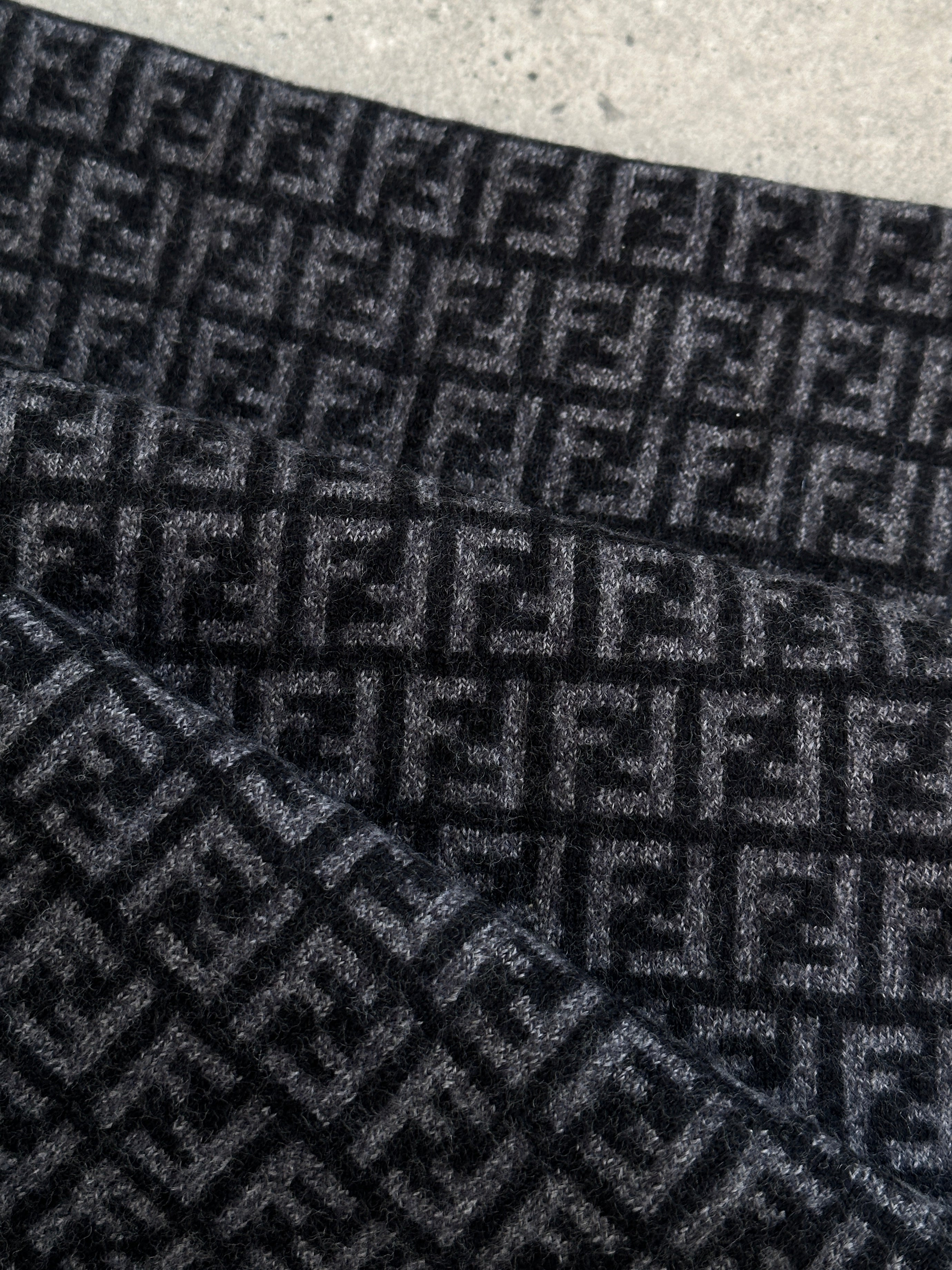 Fendi FF Monogram pure wool scarf with iconic logo pattern displayed on soft, luxurious fabric.