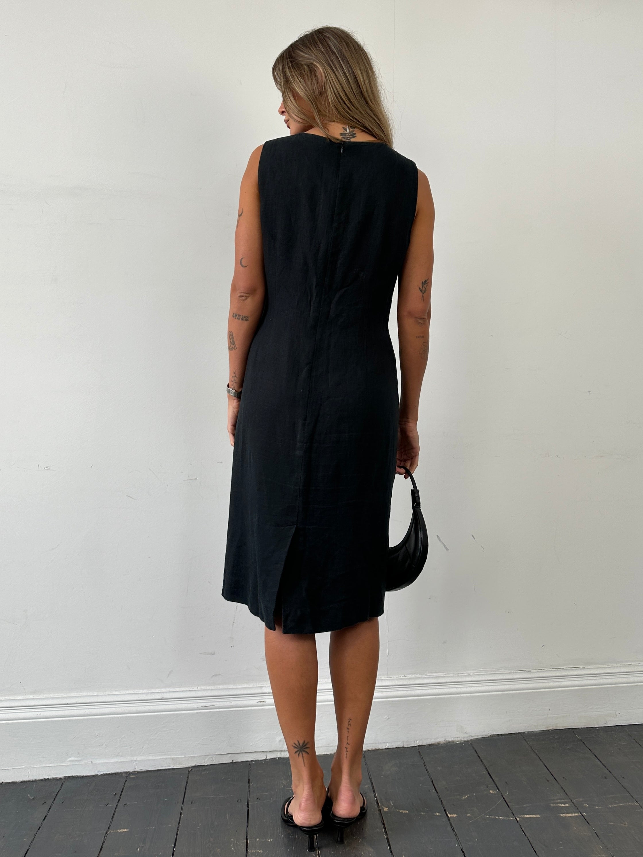 Jaeger pure linen midi sleeveless dress in M/L displayed on a hanger, showcasing its elegant, lightweight fabric and classic design.