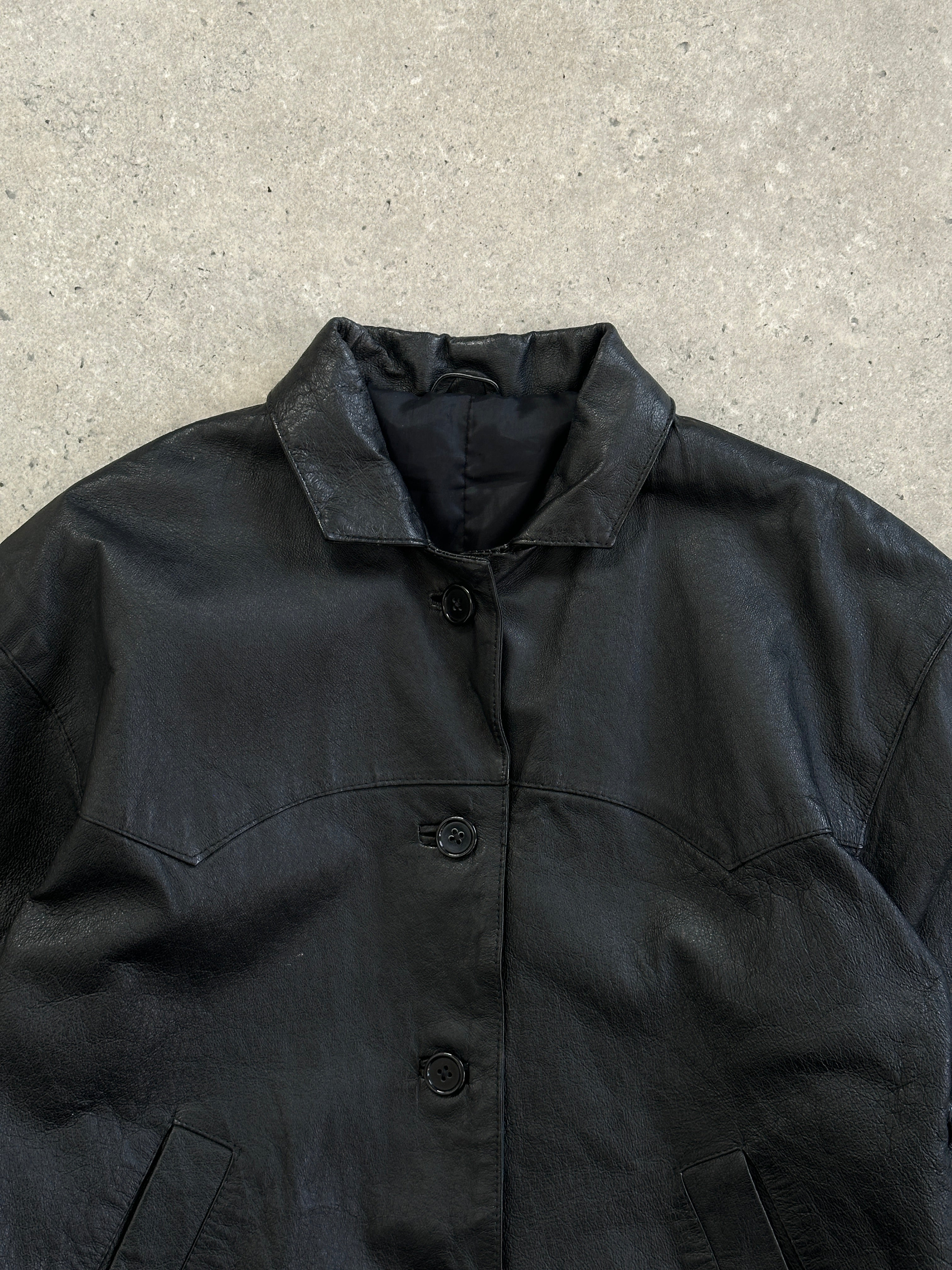 Vintage cropped leather jacket in size small, featuring classic design with textured leather and metal zipper details.